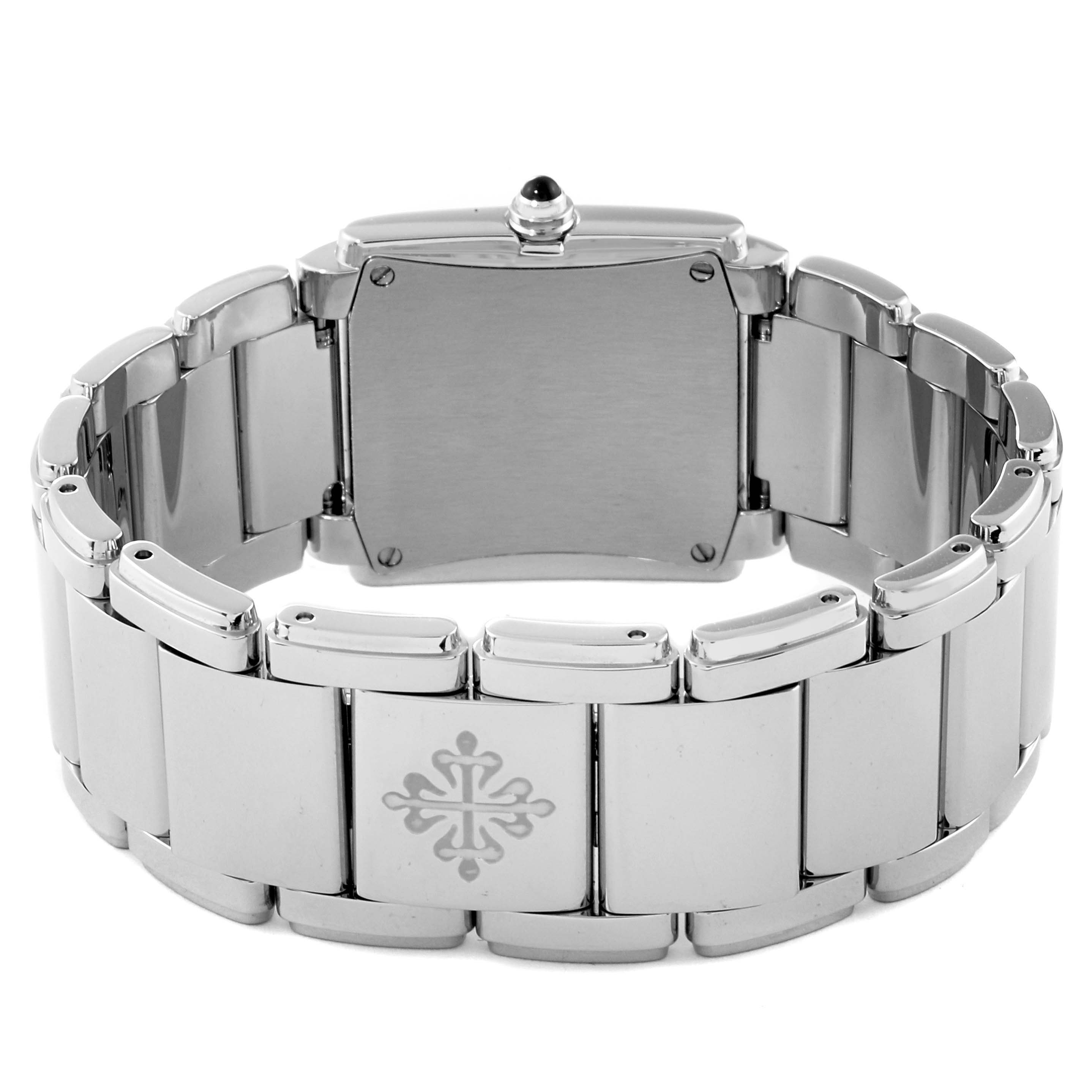 The image shows the rear view of a Patek Philippe Twenty-4 4910/10A-011 Women's Stainless Steel Silver Dial 4910/10A-011 Women's Stainless Steel Silver Dial watch with a close-up of its bracelet and clasp.