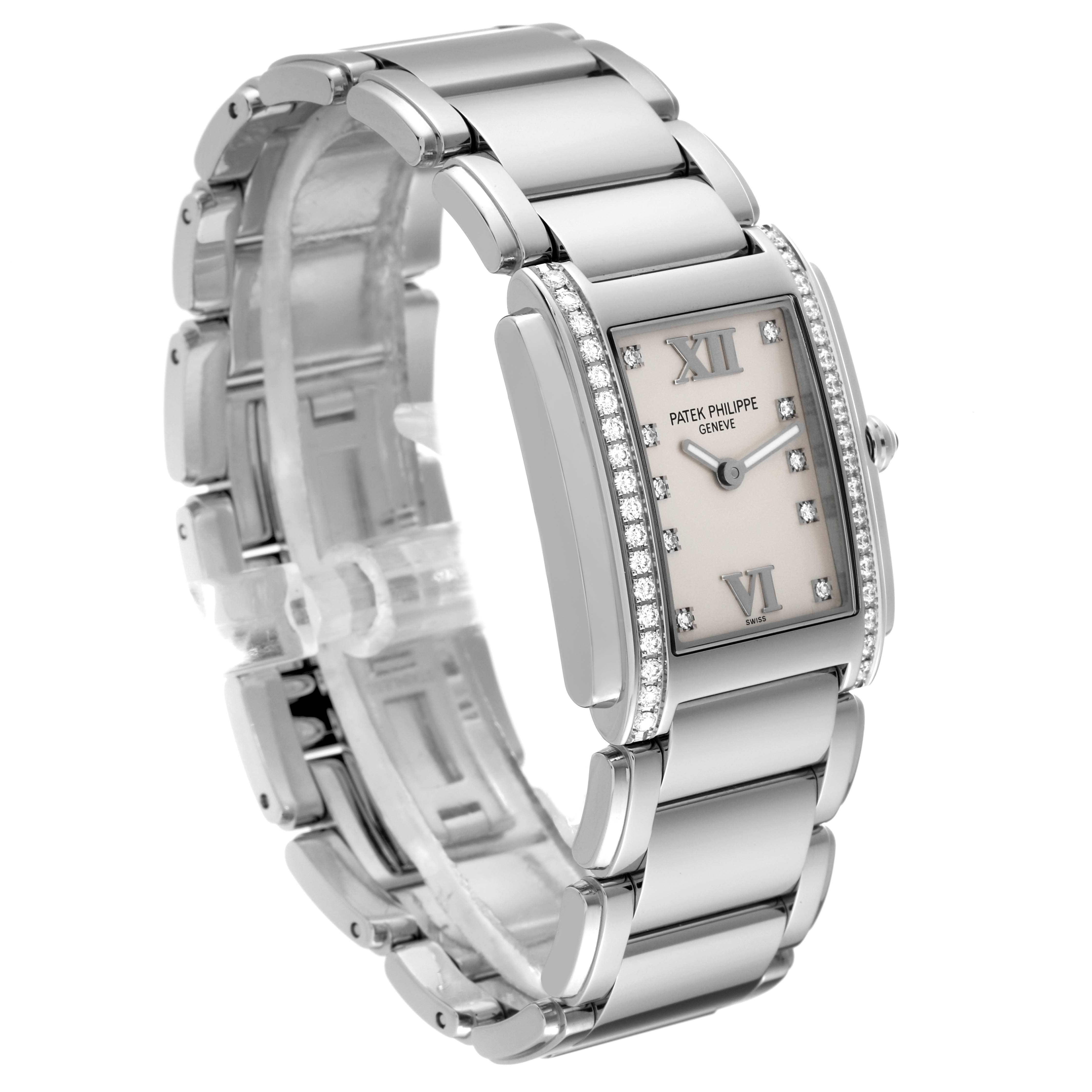 This image shows a Patek Philippe Twenty-4 4910/10A-011 Women's Stainless Steel Silver Dial 4910/10A-011 Women's Stainless Steel Silver Dial watch at a three-quarter angle, highlighting its face, band, and clasp.