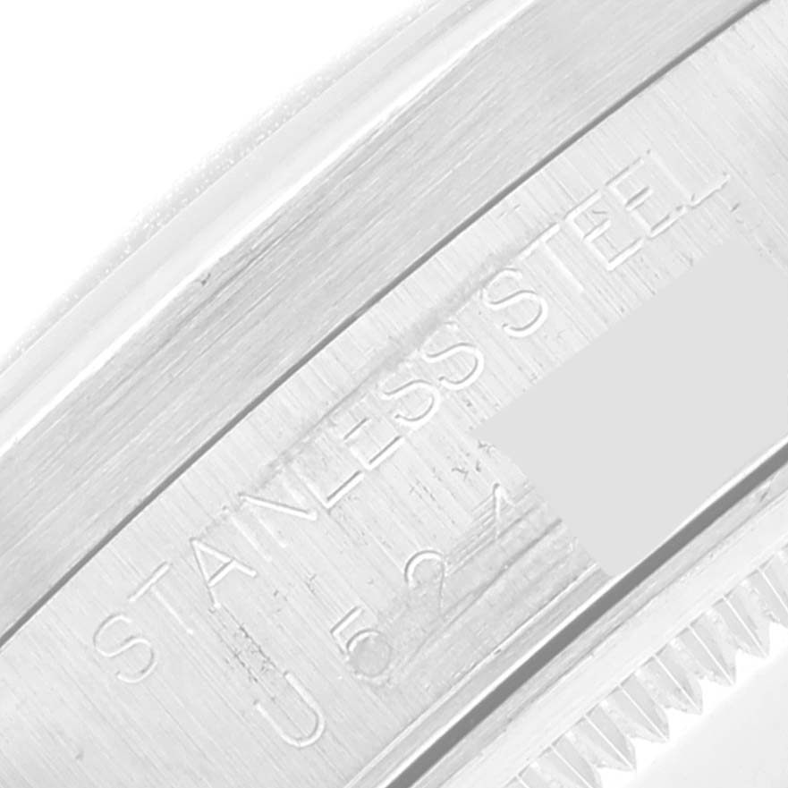 The image shows a close-up of the side of a stainless steel Rolex Air-King 14010 Men's Stainless Steel Silver Dial 14010 Men's Stainless Steel Silver Dial watch, highlighting part of the engraved text.
