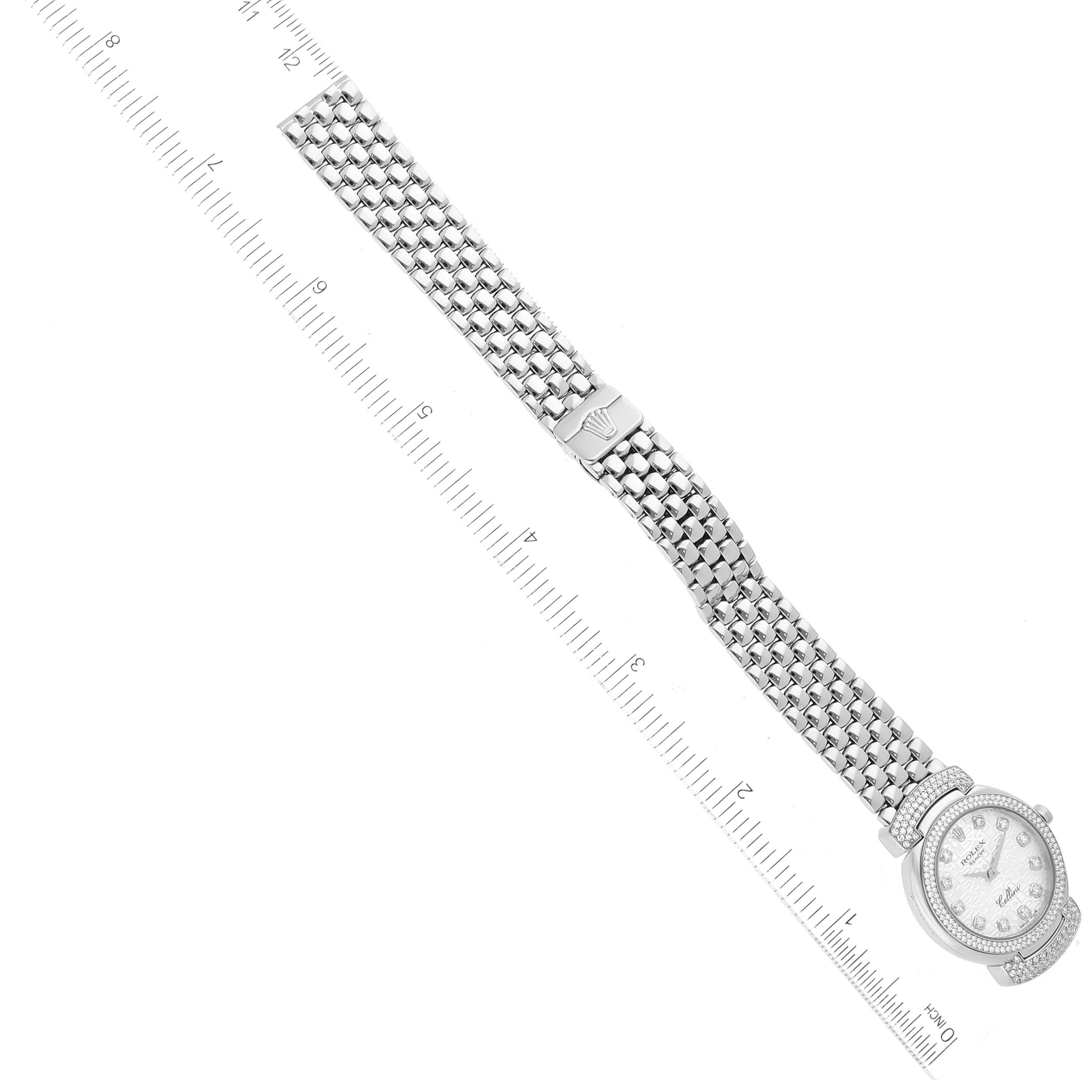 The image shows a Rolex Cellini 6673 Women's White Gold Silver Dial 6673 Women's White Gold Silver Dial watch laid flat with its face, bracelet, and clasp aligned beside a ruler for scale.