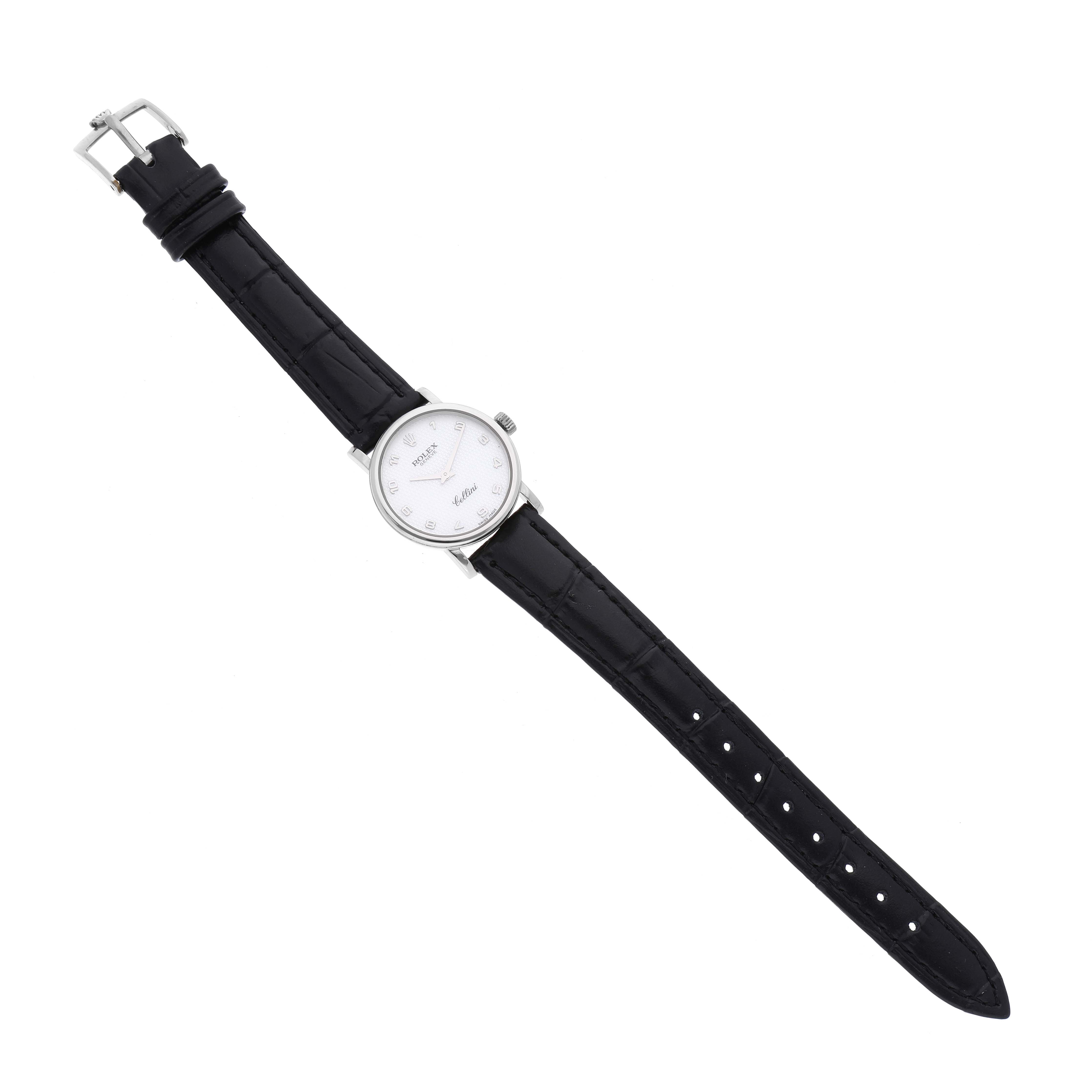 The Rolex Cellini 6110 Women's White Gold Mother of Pearl Dial 6110 Women's White Gold Mother of Pearl Dial watch is shown fully extended at a top-down angle, displaying its entire black leather strap and white watch face.