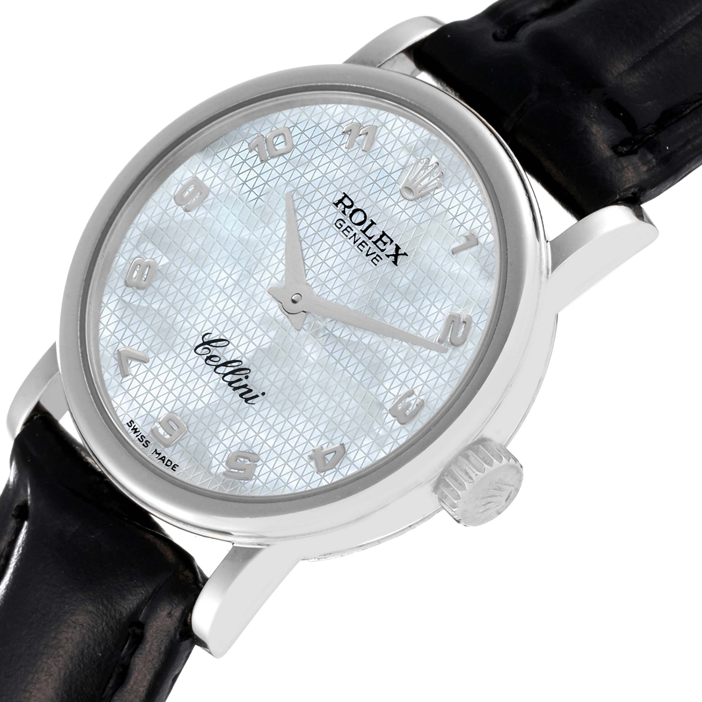 The Rolex Cellini 6110 Women's White Gold Mother of Pearl Dial 6110 Women's White Gold Mother of Pearl Dial watch is shown from an angled top-down view, displaying its face, case, and black leather strap.
