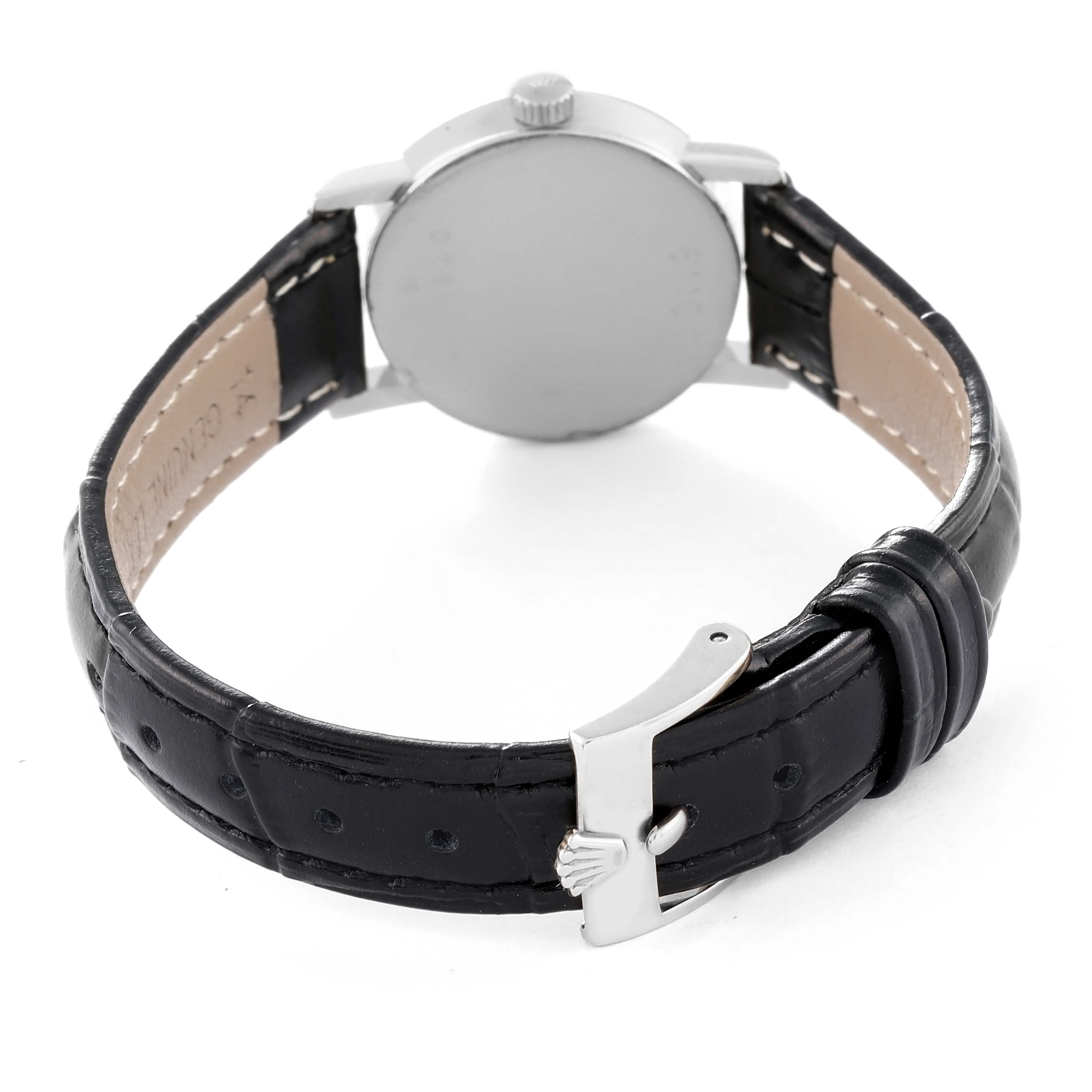 This image shows the back view of a Rolex Cellini 6110 Women's White Gold Mother of Pearl Dial 6110 Women's White Gold Mother of Pearl Dial watch, highlighting the case, crown, and black leather strap with a clasp.