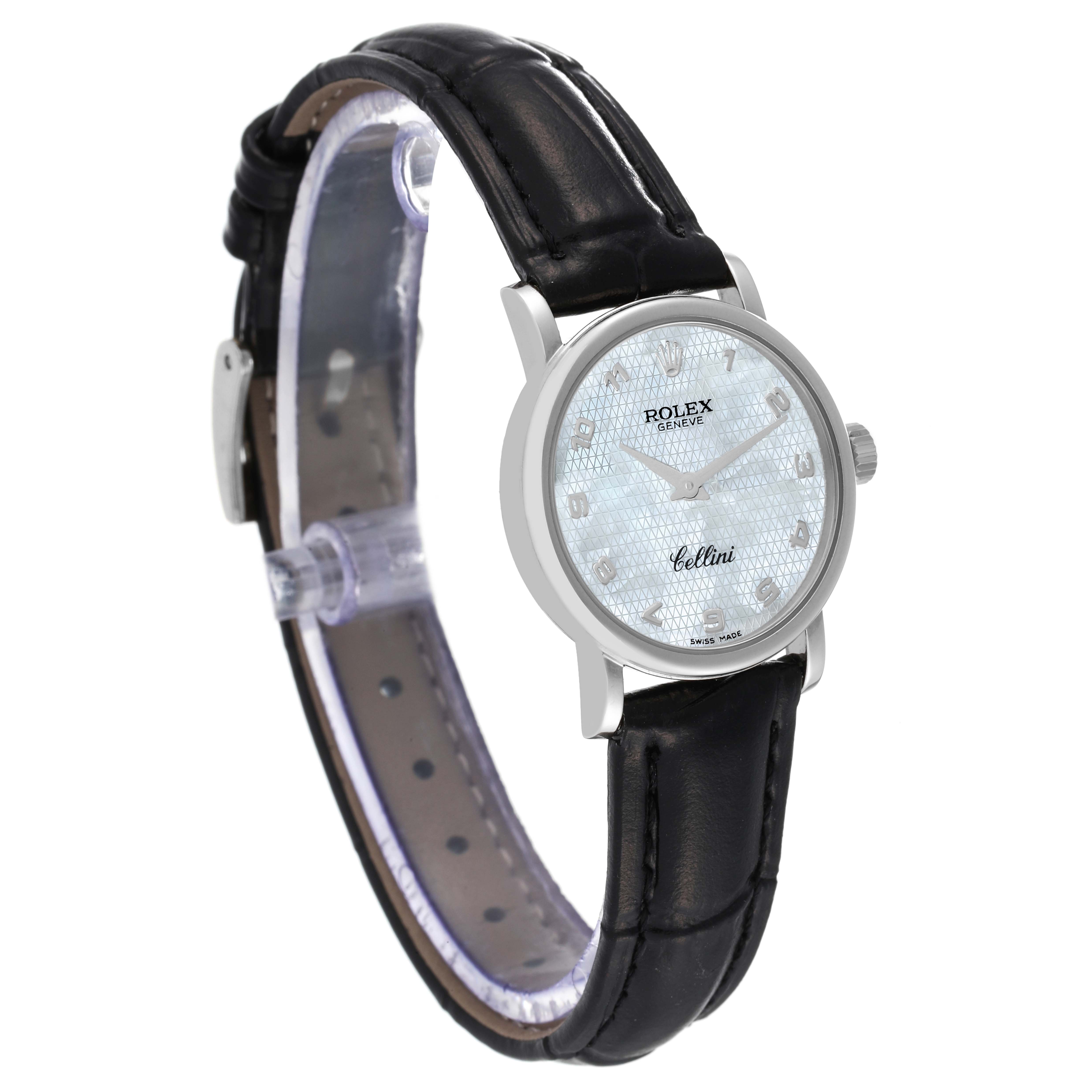 The Rolex Cellini 6110 Women's White Gold Mother of Pearl Dial 6110 Women's White Gold Mother of Pearl Dial watch is shown at an angle, highlighting its face, bezel, crown, and leather strap.