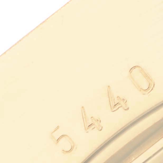 The image shows a close-up view of the case back of a Rolex Cellini 5440 Men's Yellow Gold Champagne Dial 5440 Men's Yellow Gold Champagne Dial watch, highlighting part of the engraved serial number.