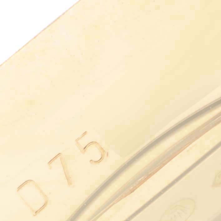 The image shows a close-up of the side of a Rolex Cellini 5440 Men's Yellow Gold Champagne Dial 5440 Men's Yellow Gold Champagne Dial watch, focusing on a portion with inscribed digits, likely part of the gold hallmark or serial number.