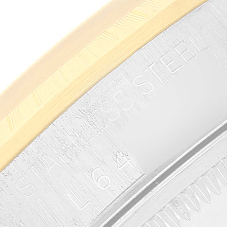 This image shows a close-up of the edge and stainless steel case of a Rolex Date 15223 Men's Steel and Gold (two tone) White Dial 15223 Men's Steel and Gold (two tone) White Dial watch.