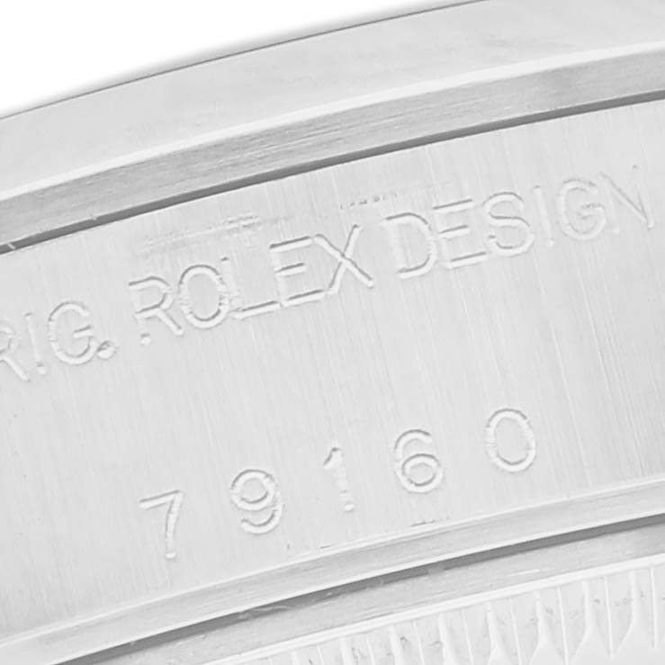 The image shows a close-up of the engraved case numbers on a Rolex Date 79160 Women
s Stainless Steel Silver Dial 79160 Women
s Stainless Steel Silver Dial model watch.