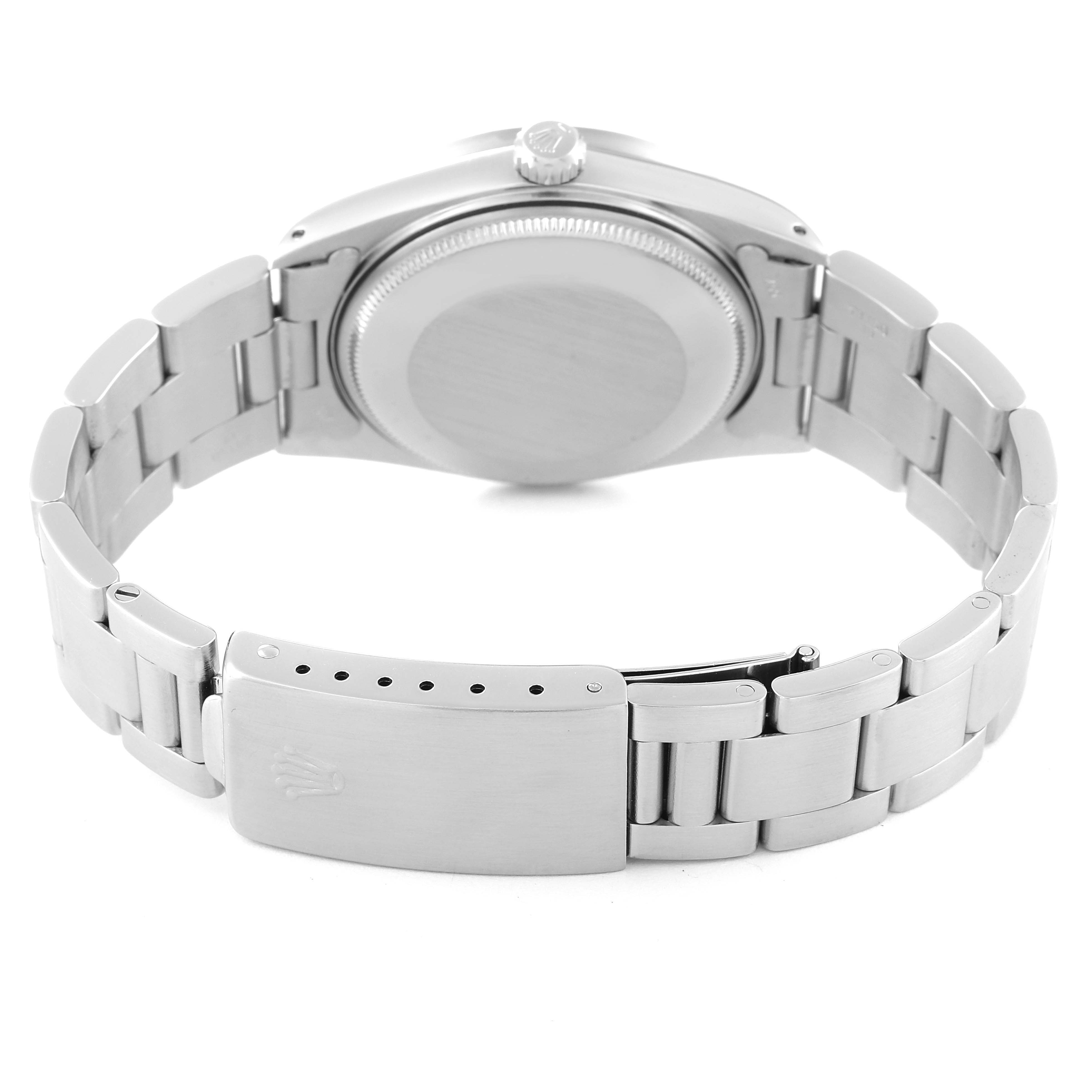 The image shows the back of a Rolex Date 15010 Men's Stainless Steel Black Dial 15010 Men's Stainless Steel Black Dial model watch, including the case, crown, and bracelet with clasp.