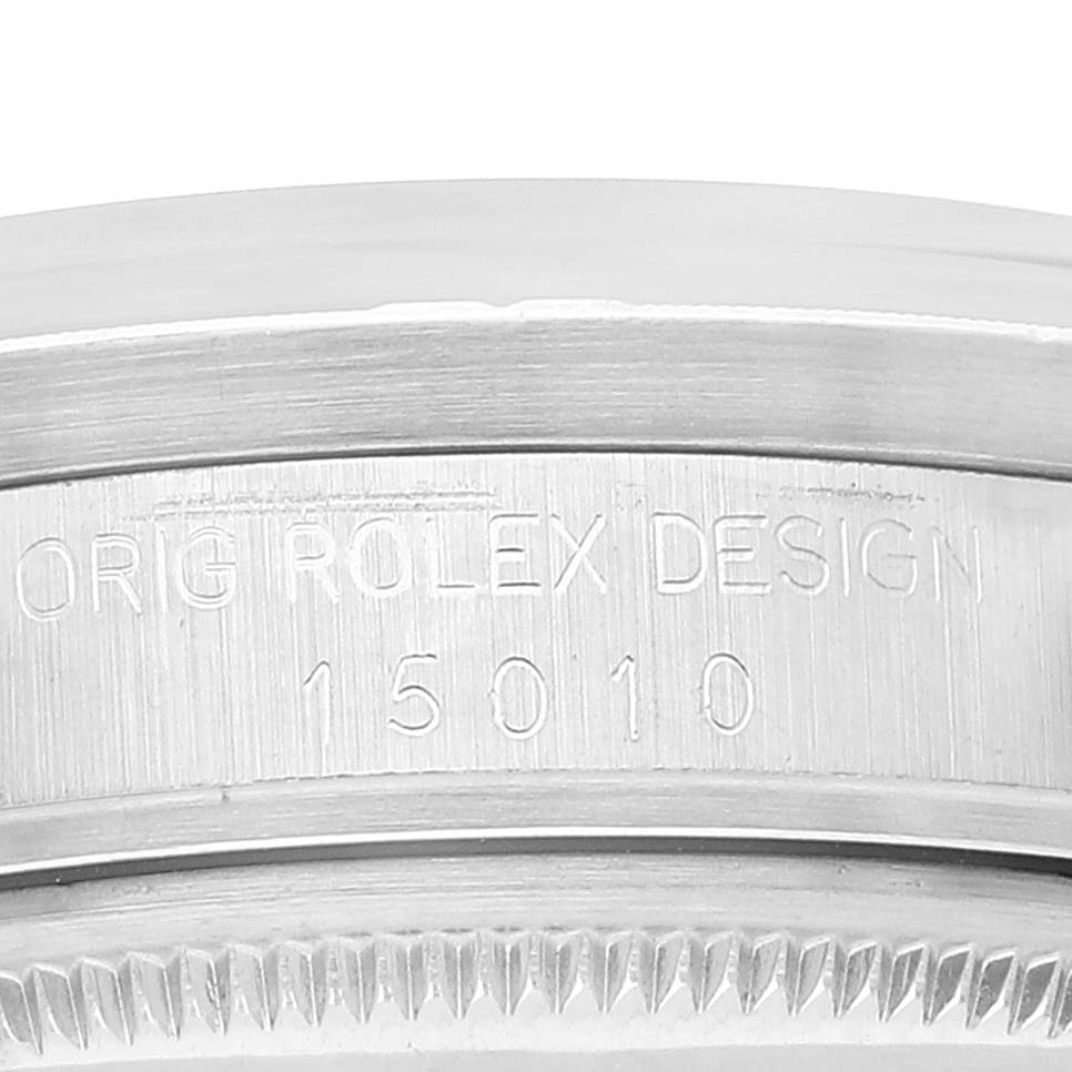 The image shows a detailed close-up of the case back engraving on a Rolex Date 15010 Men's Stainless Steel Black Dial 15010 Men's Stainless Steel Black Dial model, highlighting "ORIG ROLEX DESIGN" and the model number "15010".