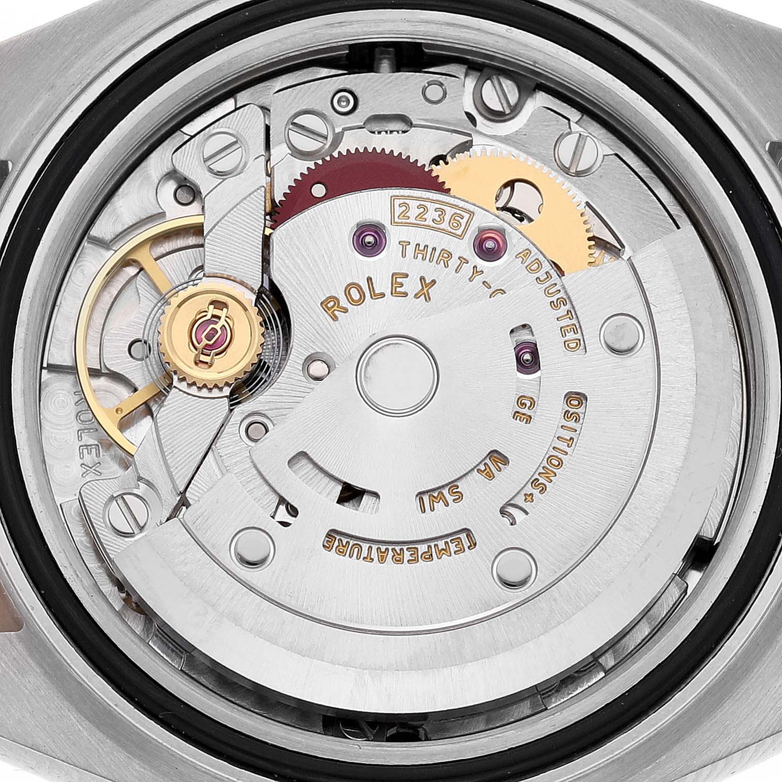 The image shows the movement of a Rolex Datejust 279381RBR Women's Steel and Gold (two tone) Pink Dial watch from a rear angle, highlighting the mechanism and rotor.