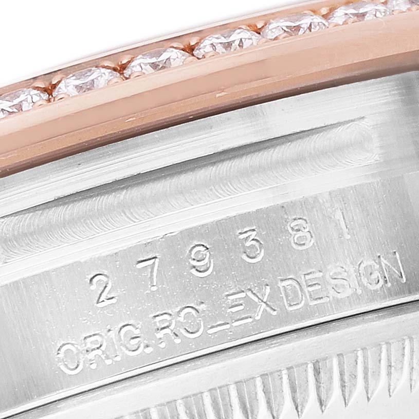 The image shows a close-up of a Rolex Datejust 279381RBR Women's Steel and Gold (two tone) Pink Dial bezel with diamonds and engraved design code.
