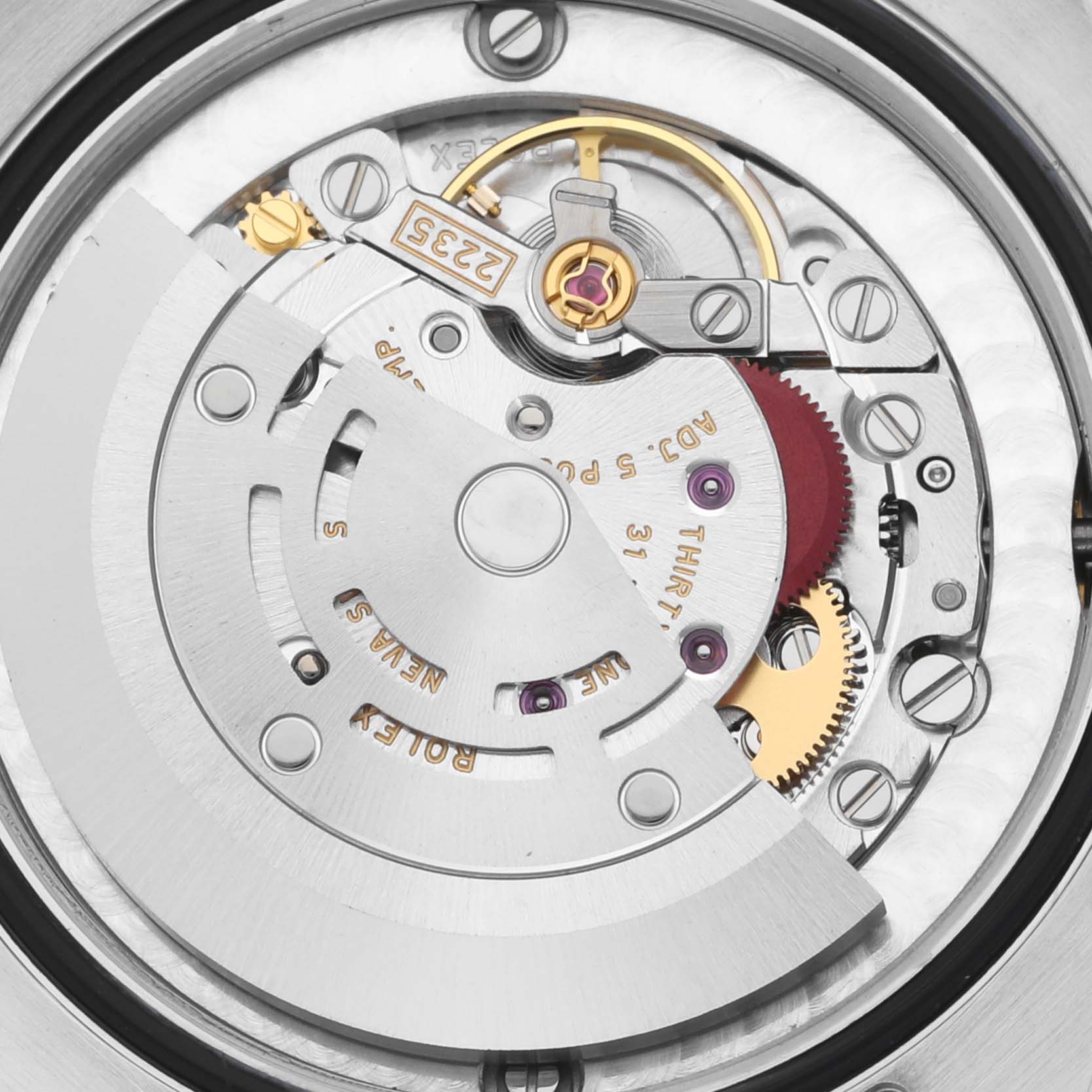 This image shows an internal view of the Rolex Mid-Size 178343 Women's Steel and Gold (two tone) Mother of Pearl Dial 178343 Women's Steel and Gold (two tone) Mother of Pearl Dial model watch, focusing on its intricate movement components.