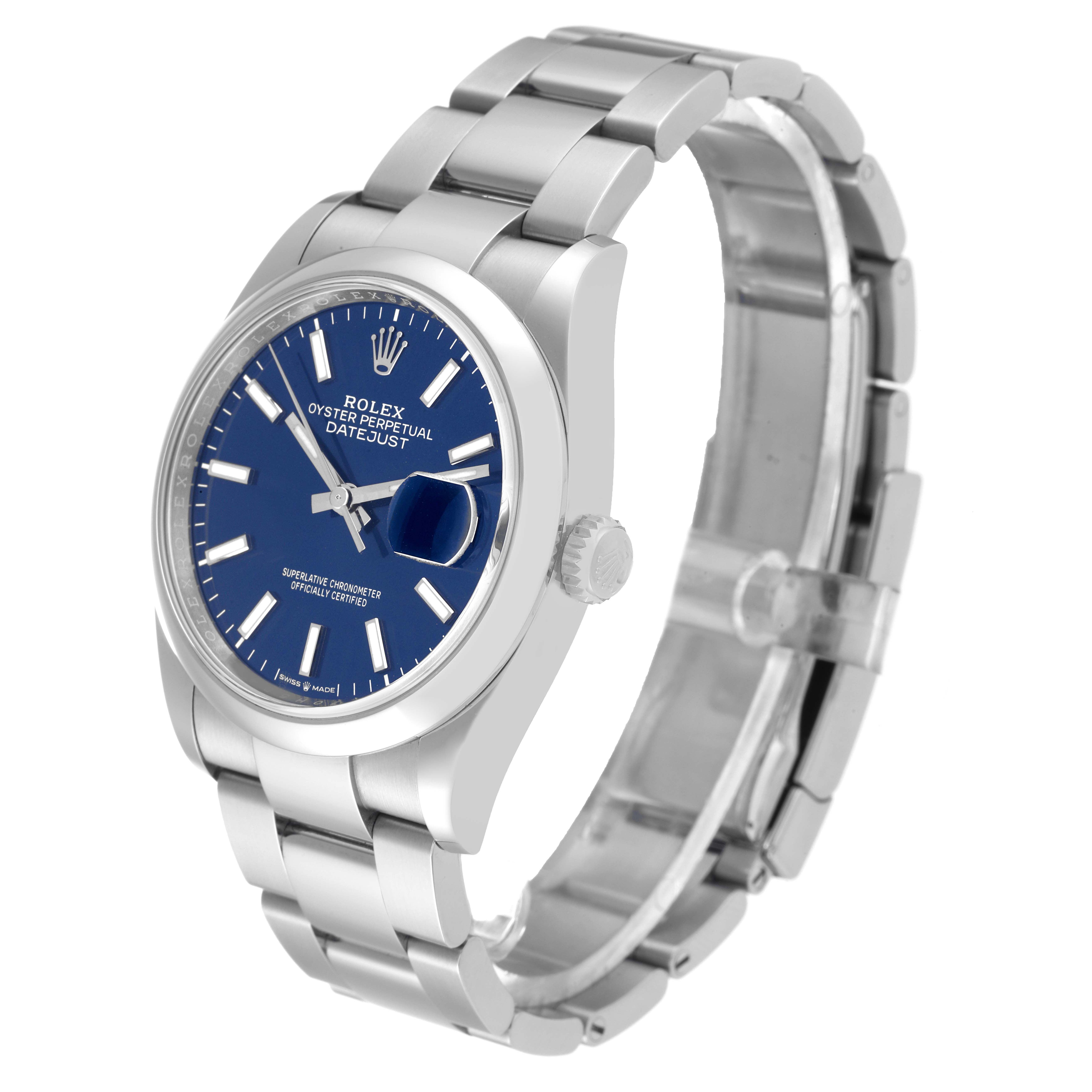 The image shows a side view of a Rolex Datejust 126200 Men's Stainless Steel Blue Dial 126200 Men's Stainless Steel Blue Dial watch, highlighting its bracelet, blue dial, and crown.