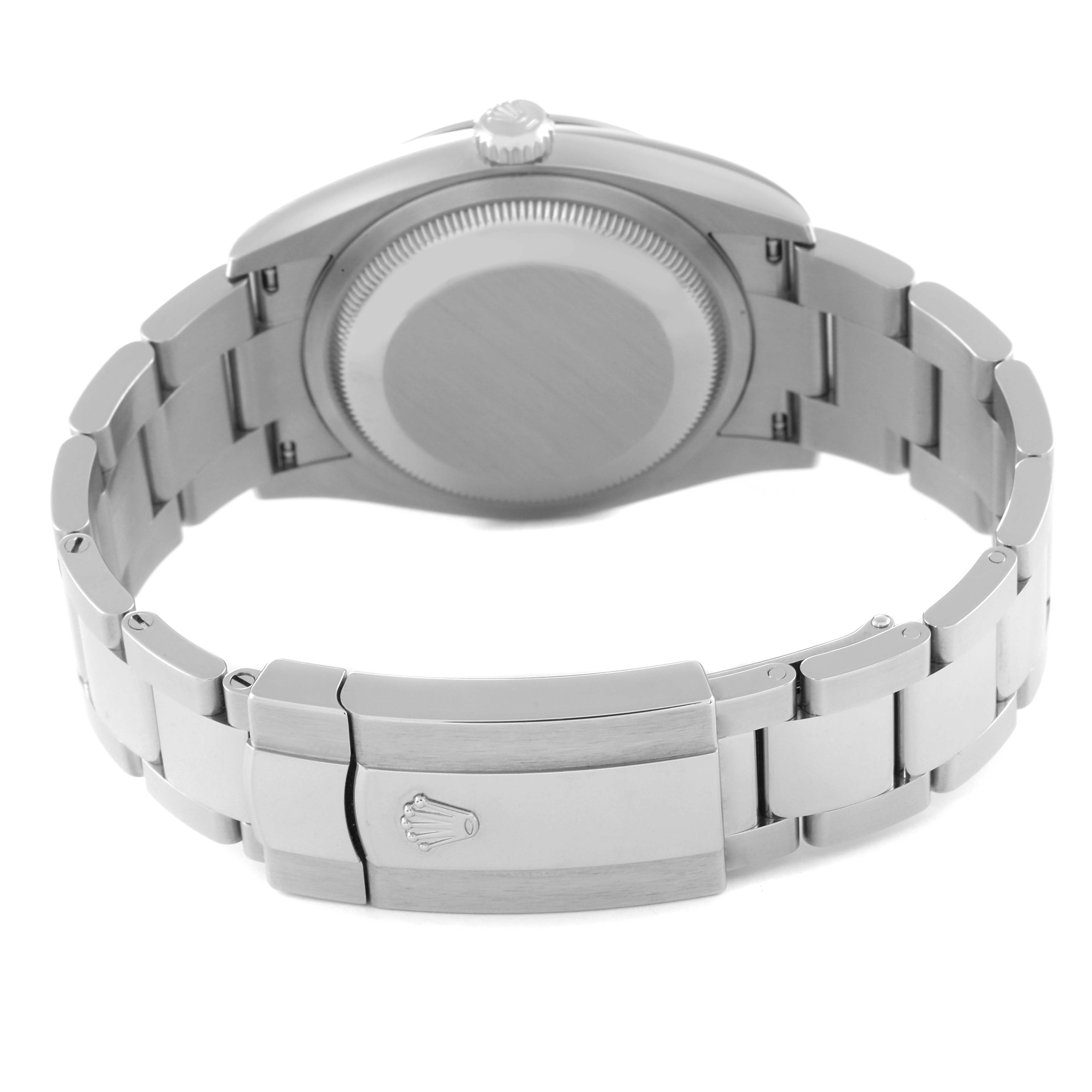 The image shows the back view of a Rolex Datejust 126200 Men's Stainless Steel Blue Dial 126200 Men's Stainless Steel Blue Dial watch, highlighting the case back and bracelet clasp.