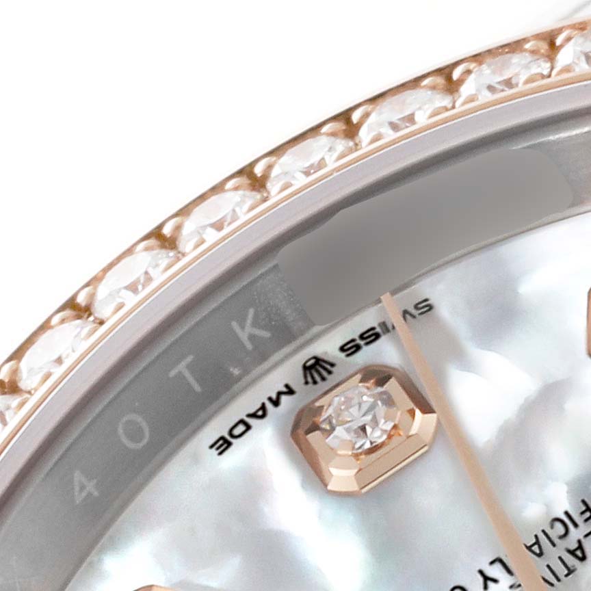 This close-up angle shows the diamond-set bezel and part of the dial including a diamond hour marker of a Rolex Datejust 126281RBR Men's Steel and Gold (two tone) Mother of Pearl Dial 126281RBR Men's Steel and Gold (two tone) Mother of Pearl Dial watch.
