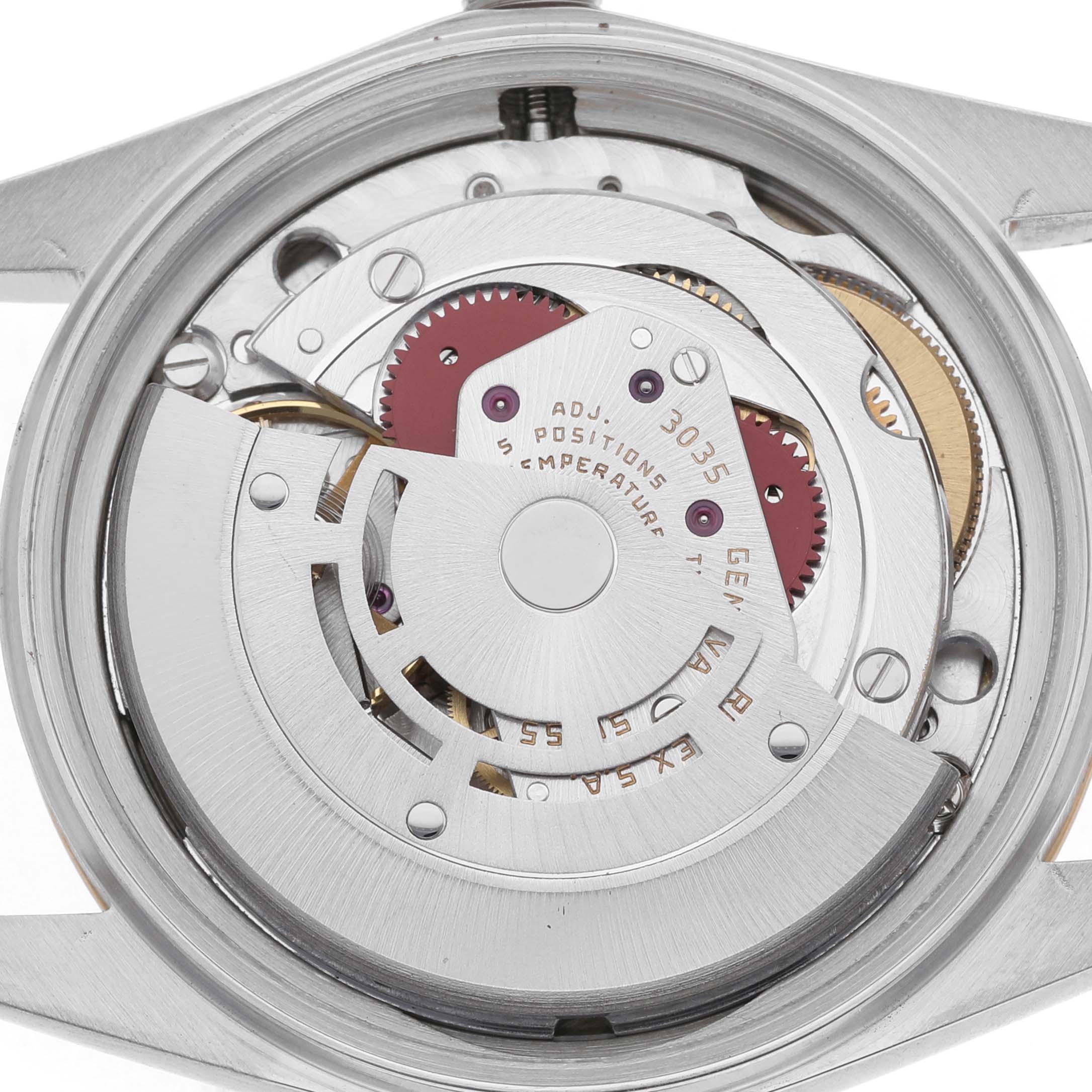 The image shows the Rolex Datejust 16013 Men's Steel and Gold (two tone) Champagne Dial's movement from a rear angle, highlighting the rotor and intricate gears.