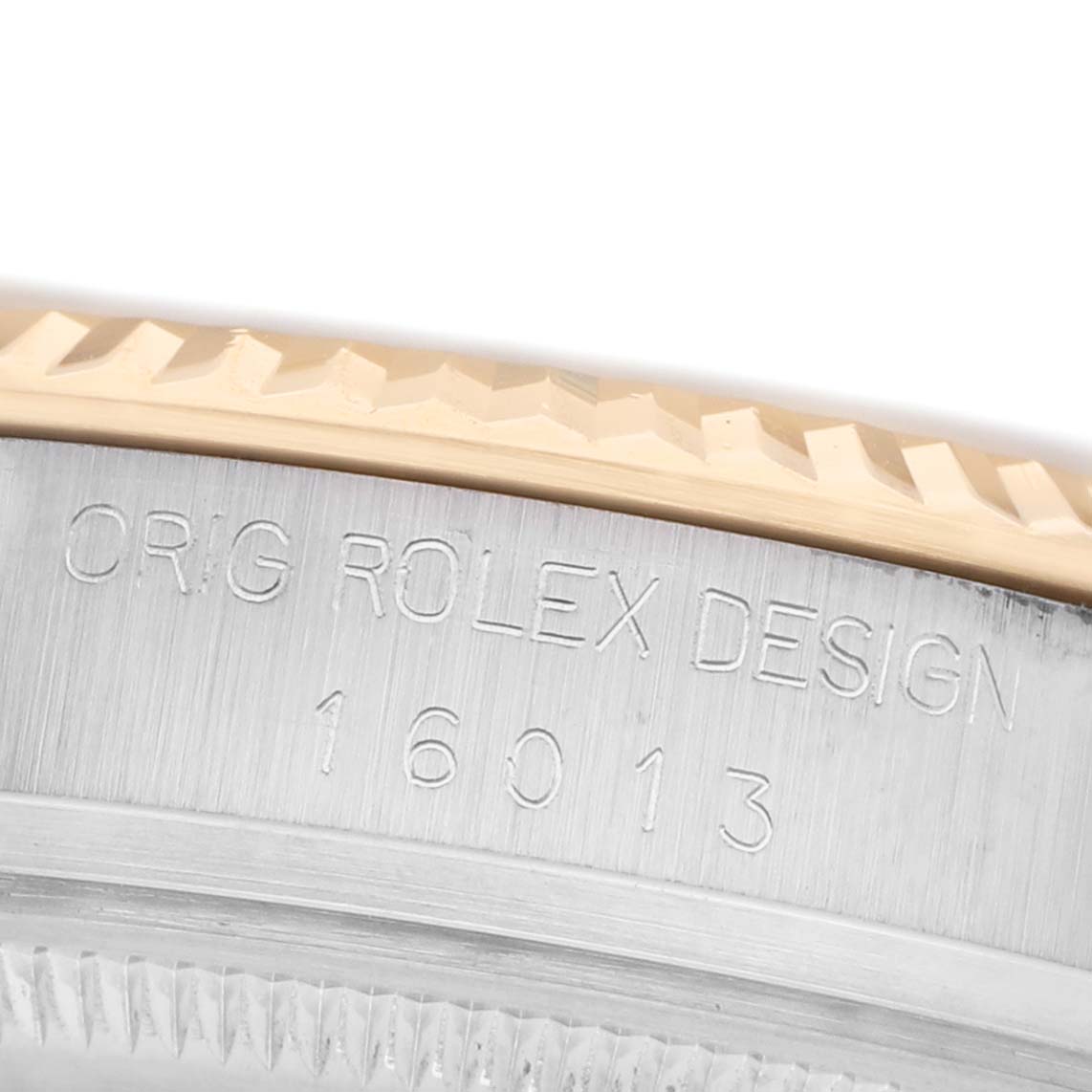 The image shows a close-up of the side of a Rolex Datejust 16013 Men's Steel and Gold (two tone) Champagne Dial watch, highlighting the engraved case design and model number.