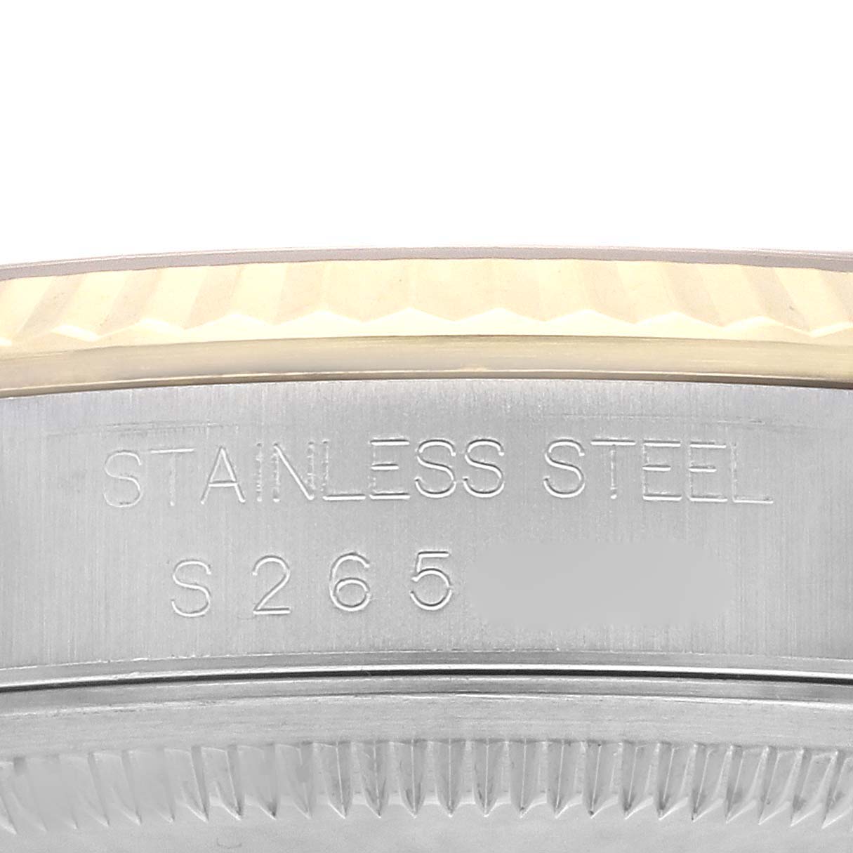 This is a close-up of the case side showing the "STAINLESS STEEL" engraving on a Rolex Datejust 16233 Men's Steel and Gold (two tone) Silver Dial 16233 Men's Steel and Gold (two tone) Silver Dial watch.