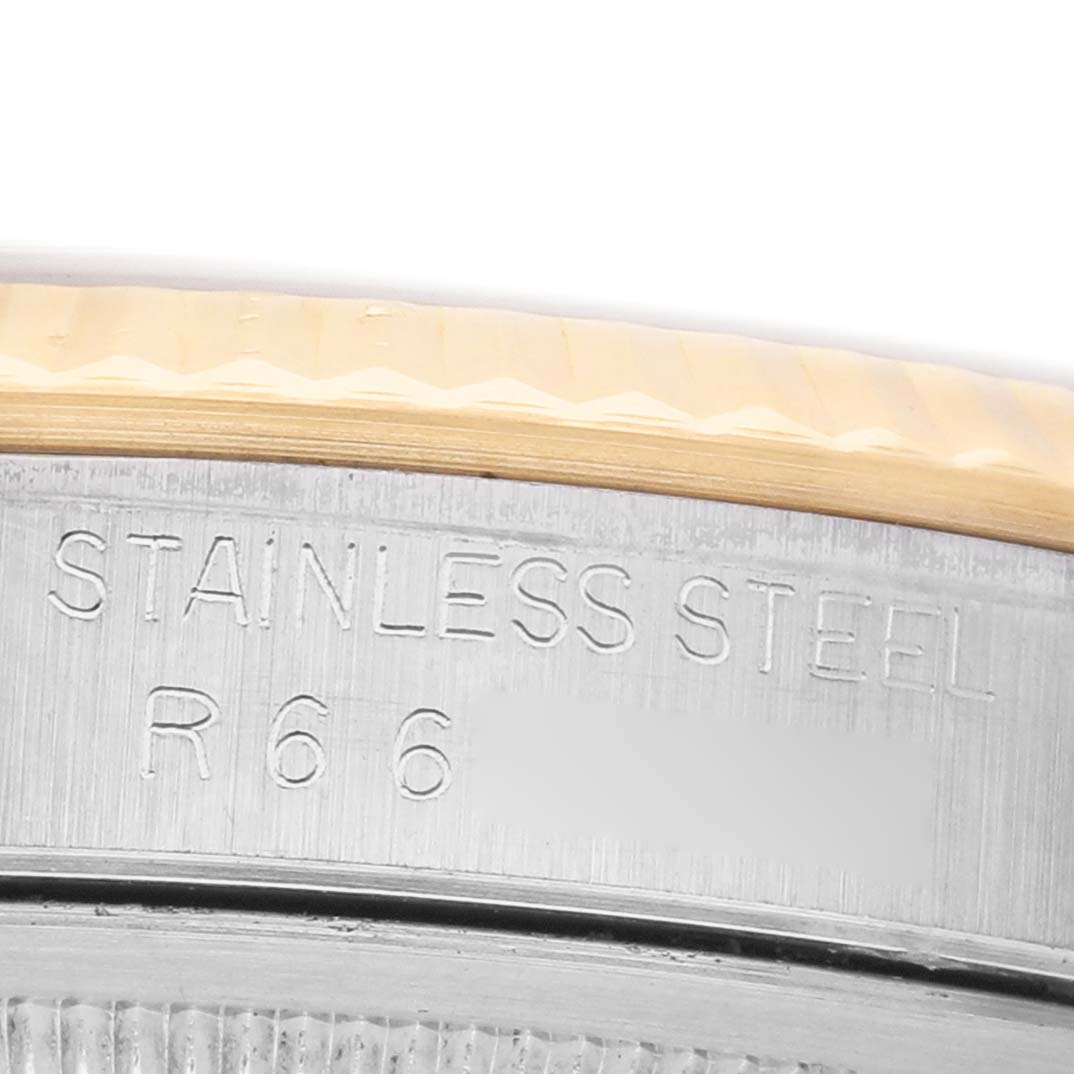 The image shows a close-up of the case back edge with "STAINLESS STEEL" engraved on a Rolex Datejust 16233 Men's Steel and Gold (two tone) White Dial.