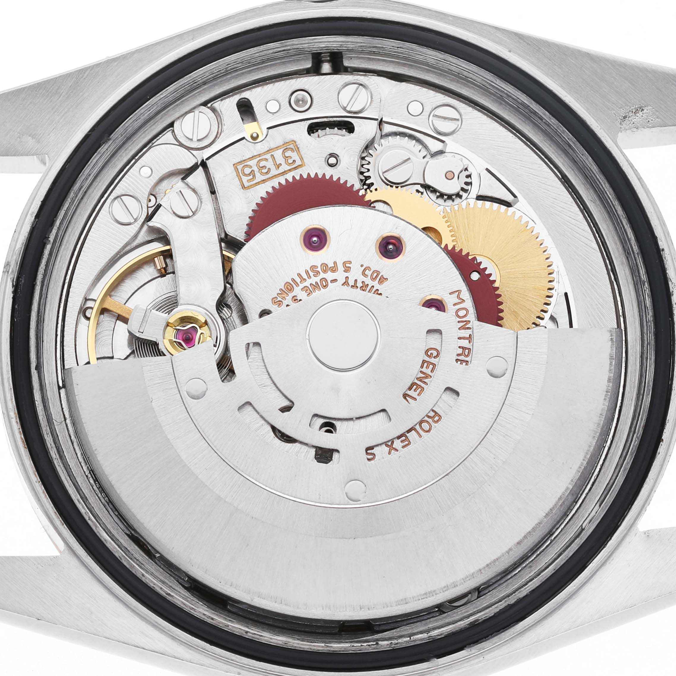 The image shows the movement of a Rolex Datejust 16233 Men's Steel and Gold (two tone) White Dial watch from the back, highlighting gears and the rotor.