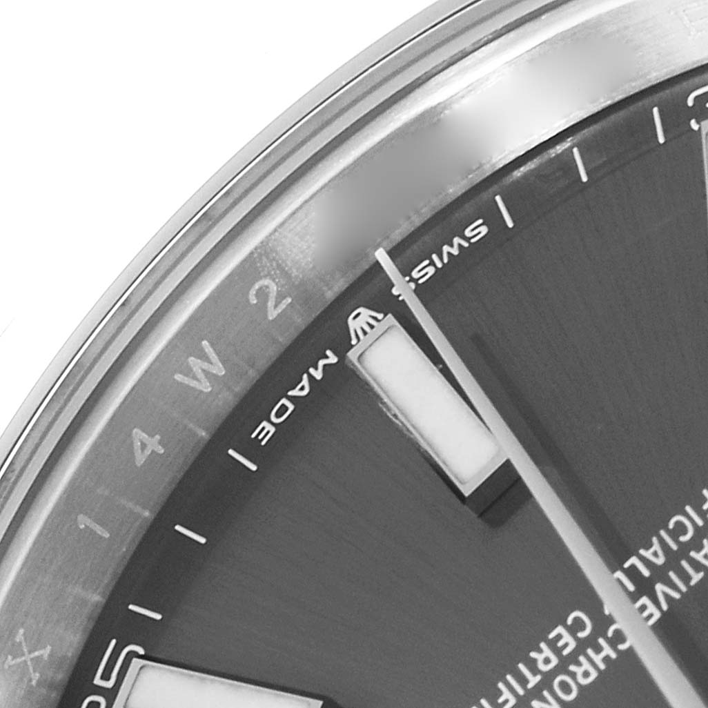 This close-up image of the Rolex Datejust 41 126300 Men
s Stainless Steel Grey Dial 126300 Men
s Stainless Steel Grey Dial watch shows part of the dial, bezel, and hour markers.