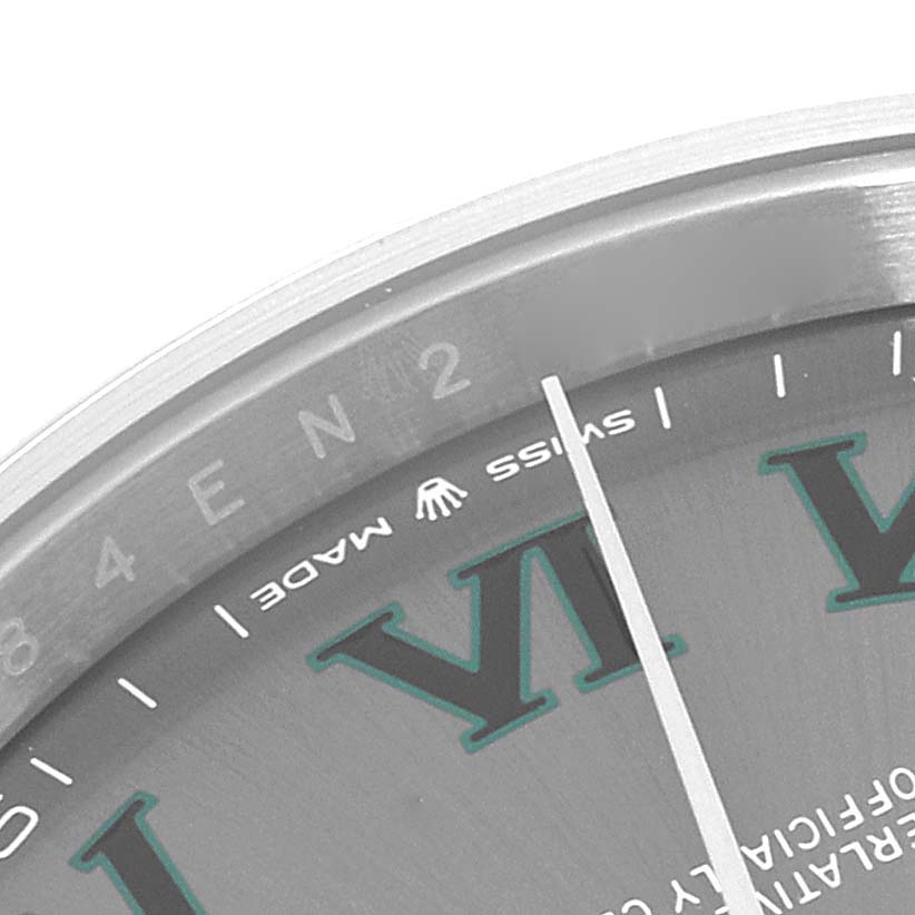 The image shows an angled close-up of the dial and bezel of the Rolex Datejust 41 126300 Men
s Stainless Steel Grey Dial 126300 Men
s Stainless Steel Grey Dial, featuring its Roman numeral "VI" and part of the "Swiss Made" text.