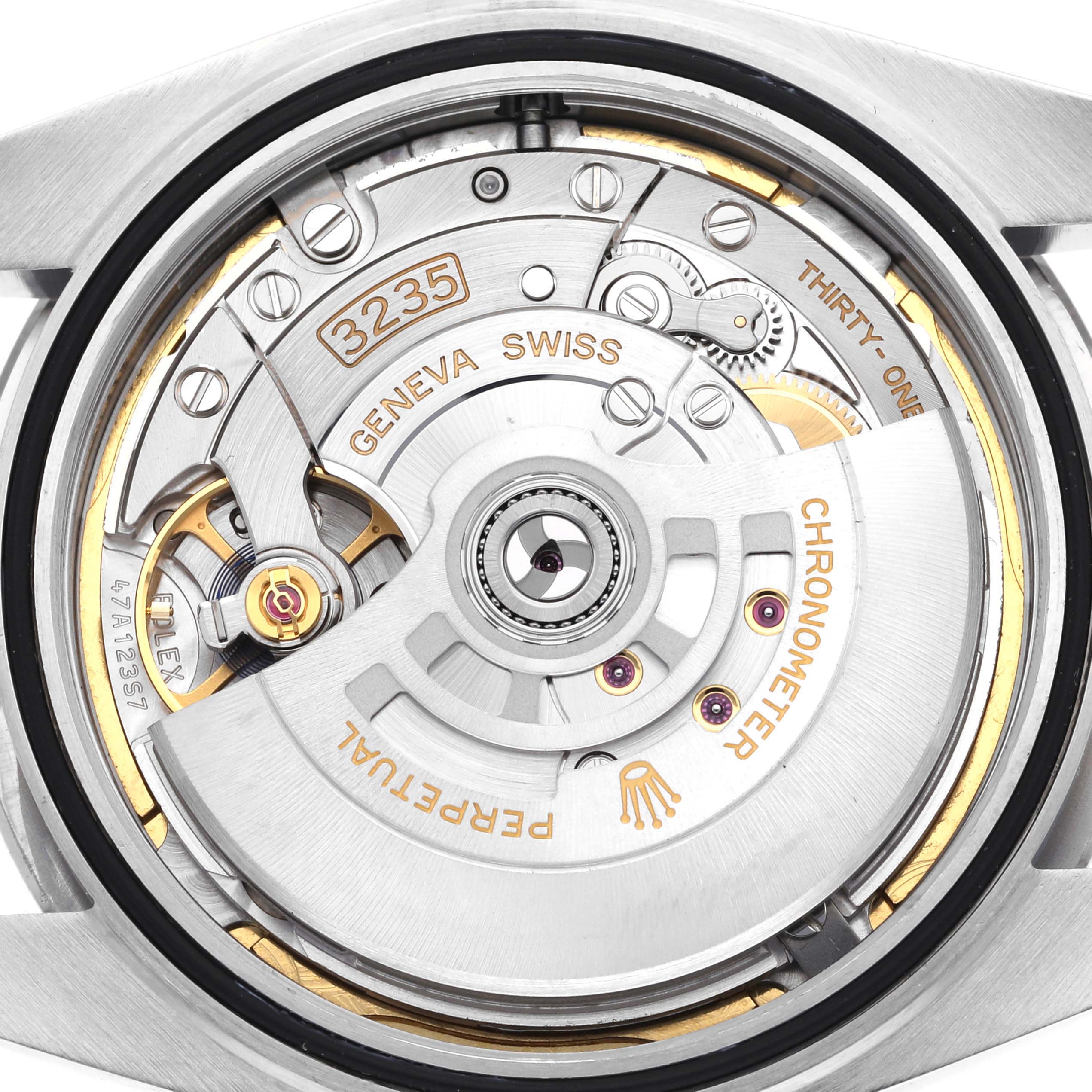 The image shows a close-up of the movement and internal mechanism of the Rolex Datejust 41 126300 Men's Stainless Steel Green Dial 126300 Men's Stainless Steel Green Dial watch.