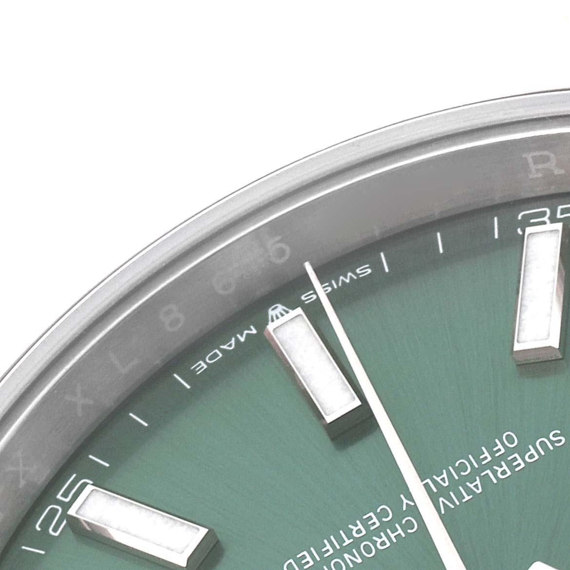 This image shows a close-up of the dial and hour markers of a Rolex Datejust 41 126300 Men's Stainless Steel Green Dial 126300 Men's Stainless Steel Green Dial watch.