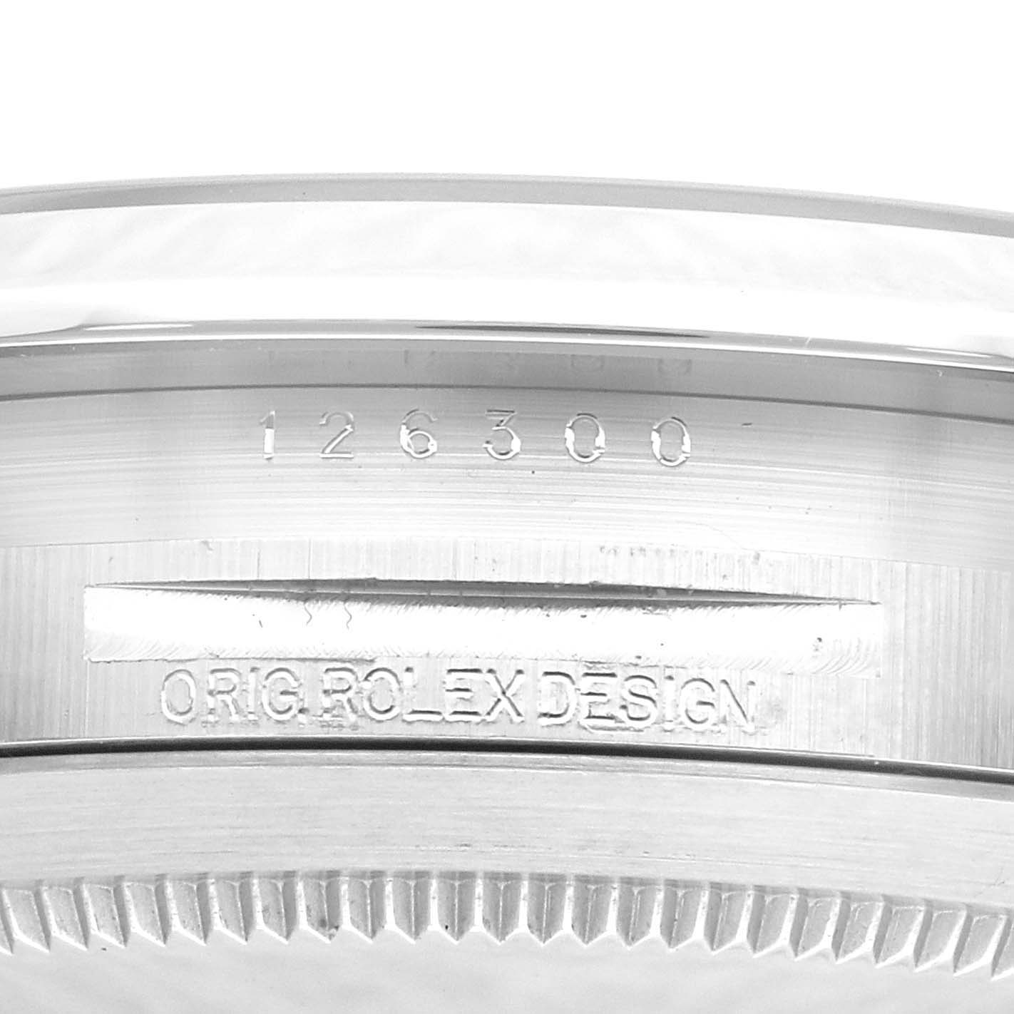 The image shows a close-up of the outer case with the model number "126300" and "ORIG. ROLEX DESIGN" engraved on a Rolex Datejust 41 126300 Men's Stainless Steel Green Dial 126300 Men's Stainless Steel Green Dial.