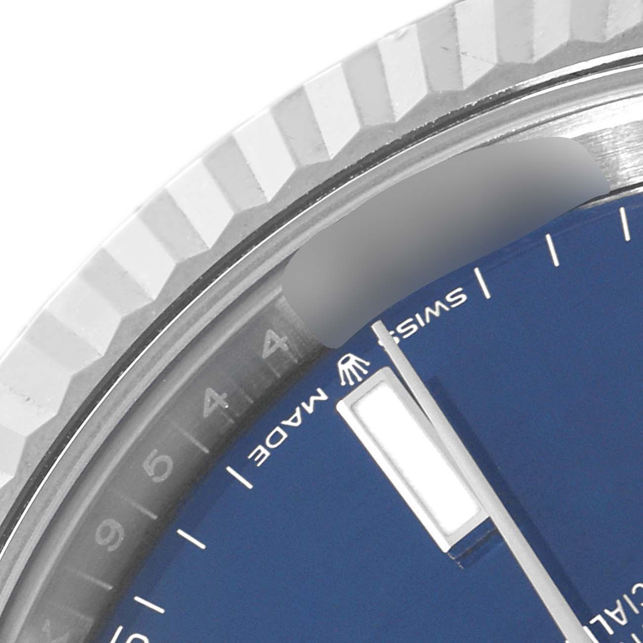 The image shows a close-up of the bezel and part of the dial of a Rolex Datejust 41 126334 Men
s Stainless Steel Blue Dial 126334 Men
s Stainless Steel Blue Dial watch, including the "Swiss Made" text.
