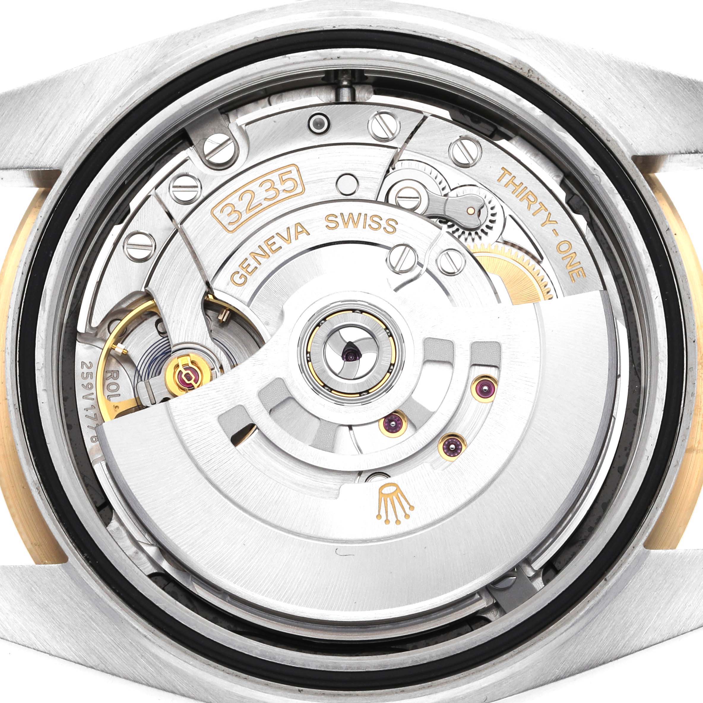 This image shows the open case back of a Datejust 41 Rolex watch displaying its movement components.