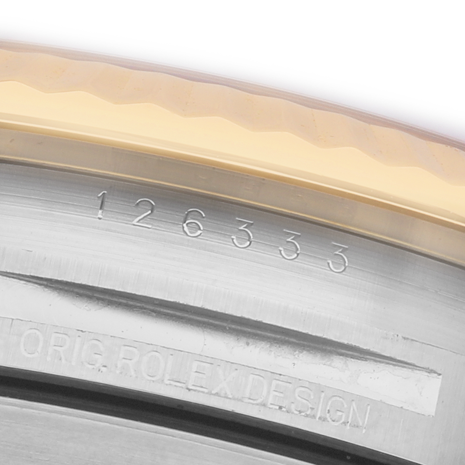 The image shows a close-up of the bezel and case edge with model and branding engravings of a Rolex Datejust 41 126333 Men's Steel and Gold (two tone) Grey Dial.