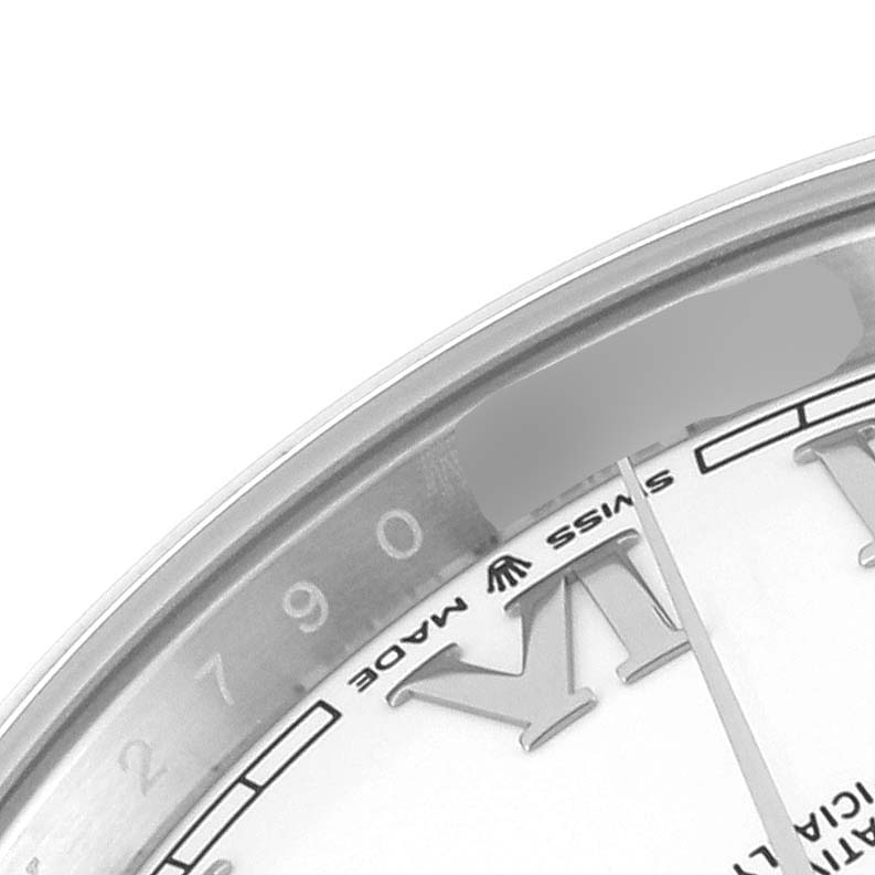 The image shows a close-up of the dial, Roman numeral, and part of the bezel of a Rolex Datejust 41 126300 Men
s Stainless Steel White Dial 126300 Men
s Stainless Steel White Dial watch.