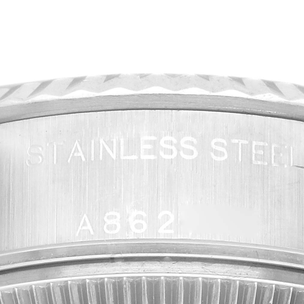 Close-up of the side engraving on a Rolex Datejust 79174 Women's Stainless Steel Blue Dial 79174 Women's Stainless Steel Blue Dial stainless steel case.