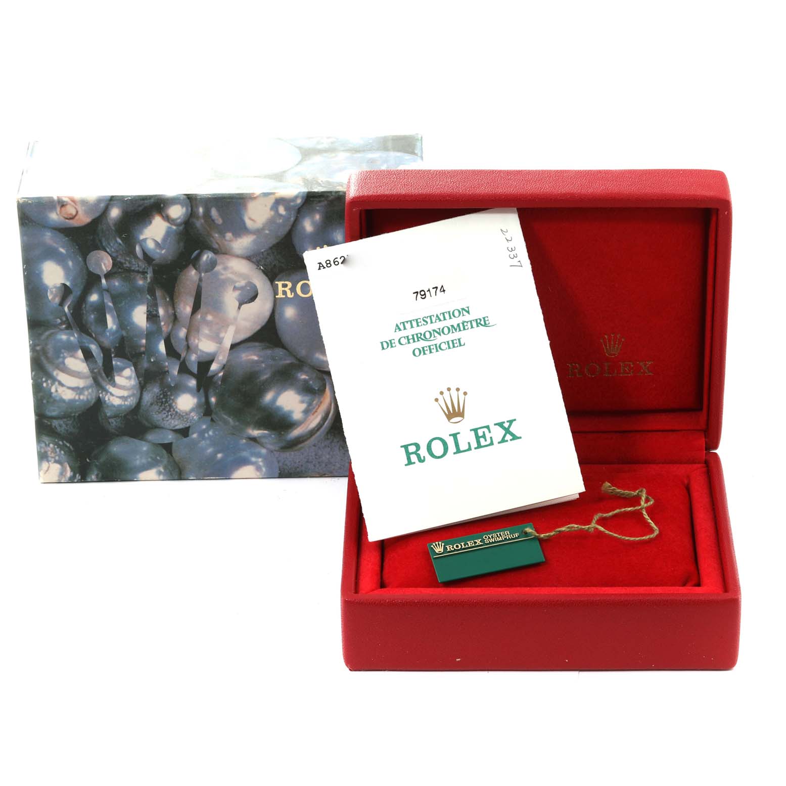 The image shows the packaging and accessories for a Rolex Datejust 79174 Women's Stainless Steel Blue Dial 79174 Women's Stainless Steel Blue Dial watch, including the box, manual, and a tag.