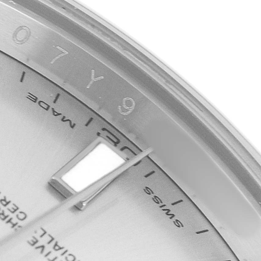 The image shows a close-up of the dial and markers of a Rolex Datejust 41 116300 Men's Stainless Steel Silver Dial, highlighting the "SWISS MADE" text and hour markers.