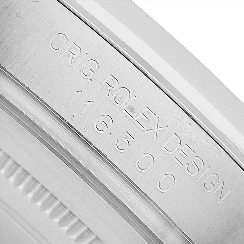 The image shows a close-up of the inner bezel detailing of a Rolex Datejust 41 116300 Men's Stainless Steel Silver Dial with engraving.