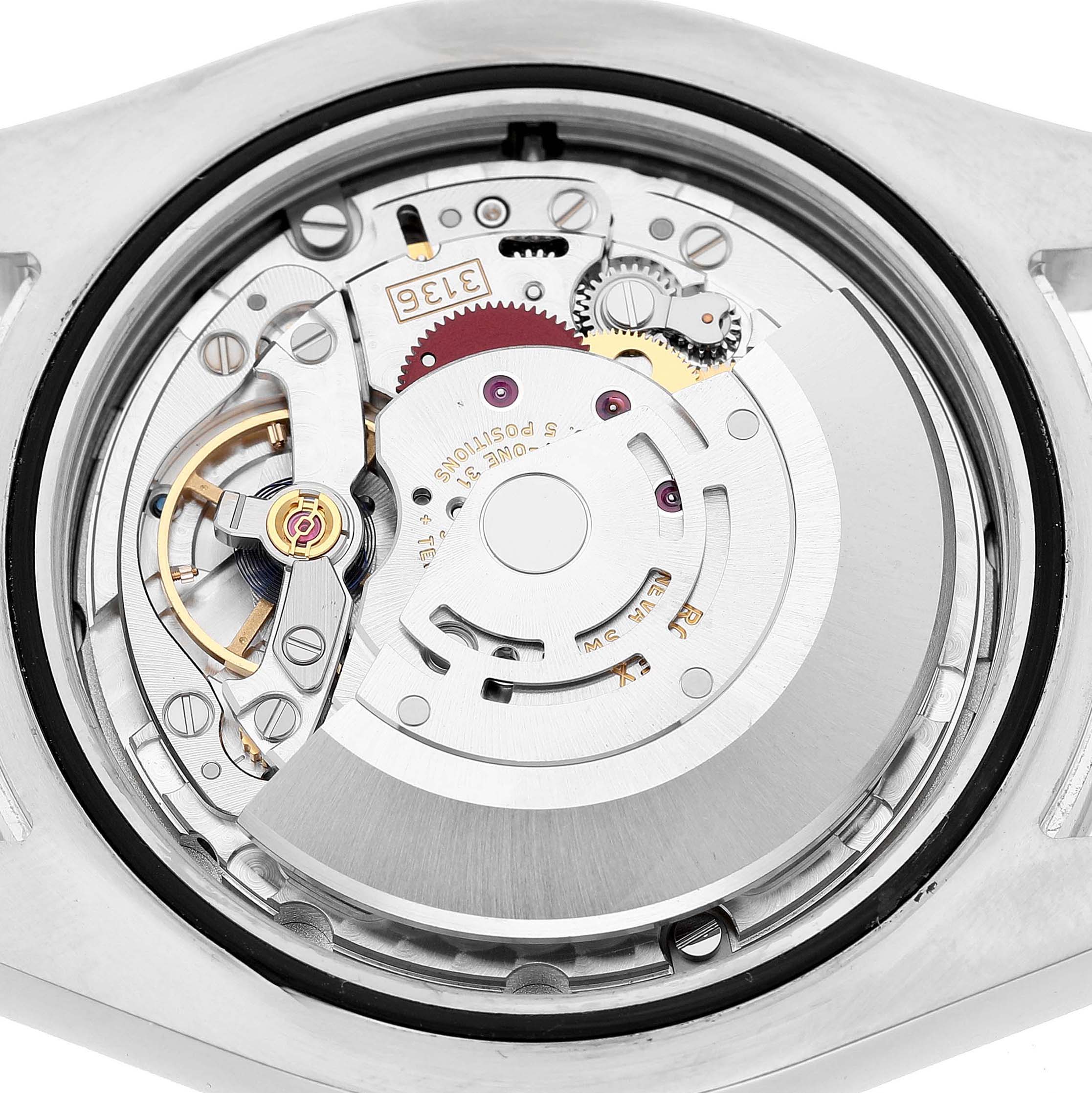 The image shows the movement of a Rolex Datejust 41 116300 Men's Stainless Steel Silver Dial, displaying its intricate internal gears and components from the back.