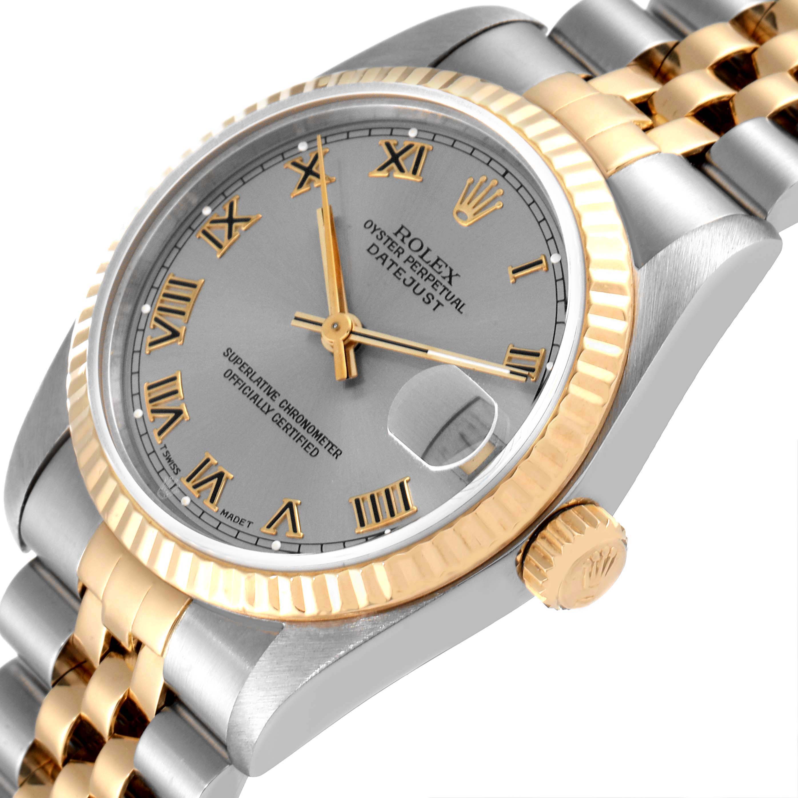 The image shows a close-up side angle of the Rolex Mid-Size 68273 Women's Steel and Gold (two tone) Grey Dial 68273 Women's Steel and Gold (two tone) Grey Dial Datejust watch, highlighting the dial, bezel, crown, and part of the bracelet.