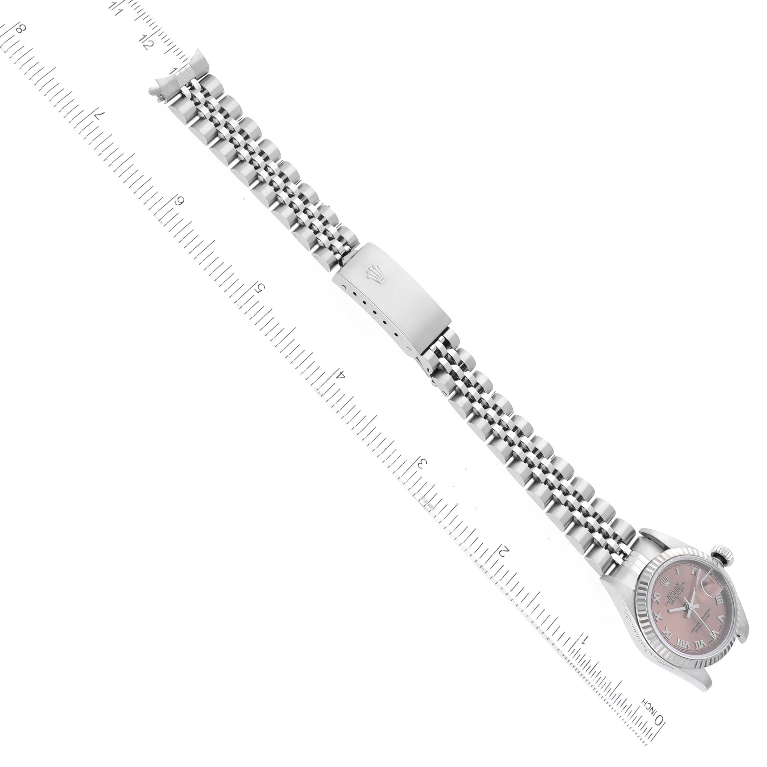 The image shows a top-down view of a Rolex Datejust 79174 Women's Stainless Steel Pink Dial 79174 Women's Stainless Steel Pink Dial watch, highlighting the bezel, crown, bracelet, and deployment clasp.