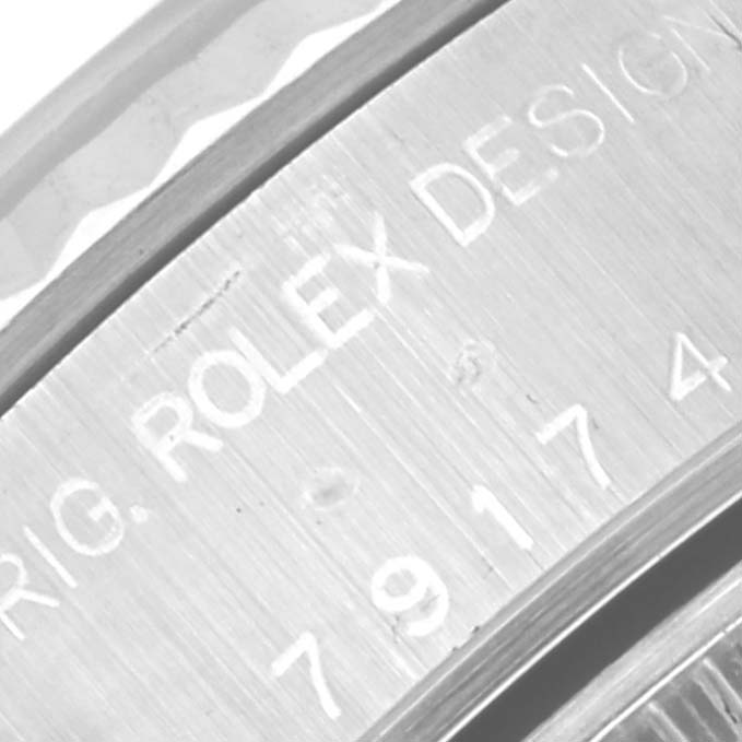 This close-up angle shows the engraving on the side of the Rolex Datejust 79174 Women's Stainless Steel Pink Dial 79174 Women's Stainless Steel Pink Dial model, revealing part of the serial number.