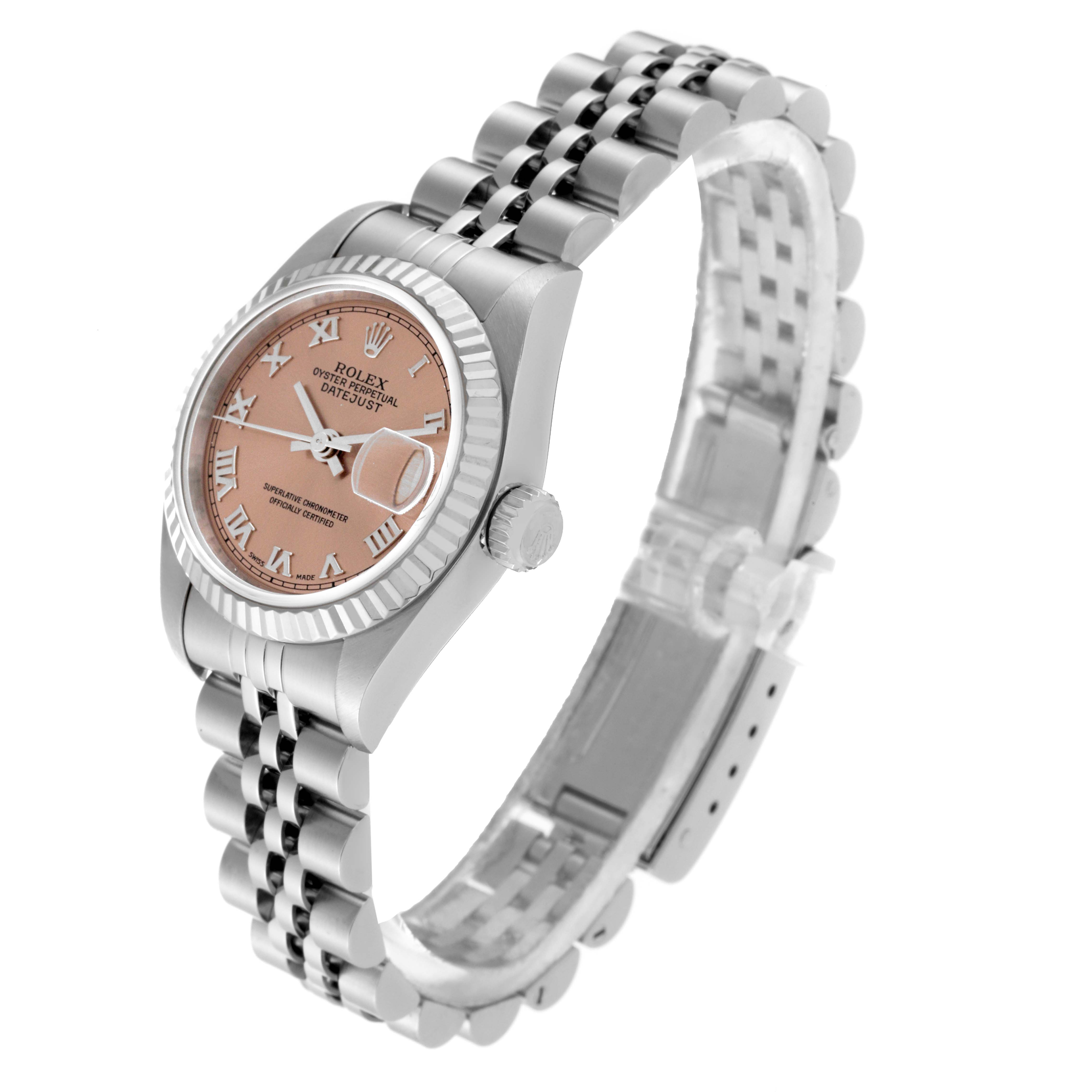 The image shows a side angle of the Rolex Datejust 79174 Women's Stainless Steel Pink Dial 79174 Women's Stainless Steel Pink Dial watch highlighting its face, bezel, crown, and jubilee bracelet.