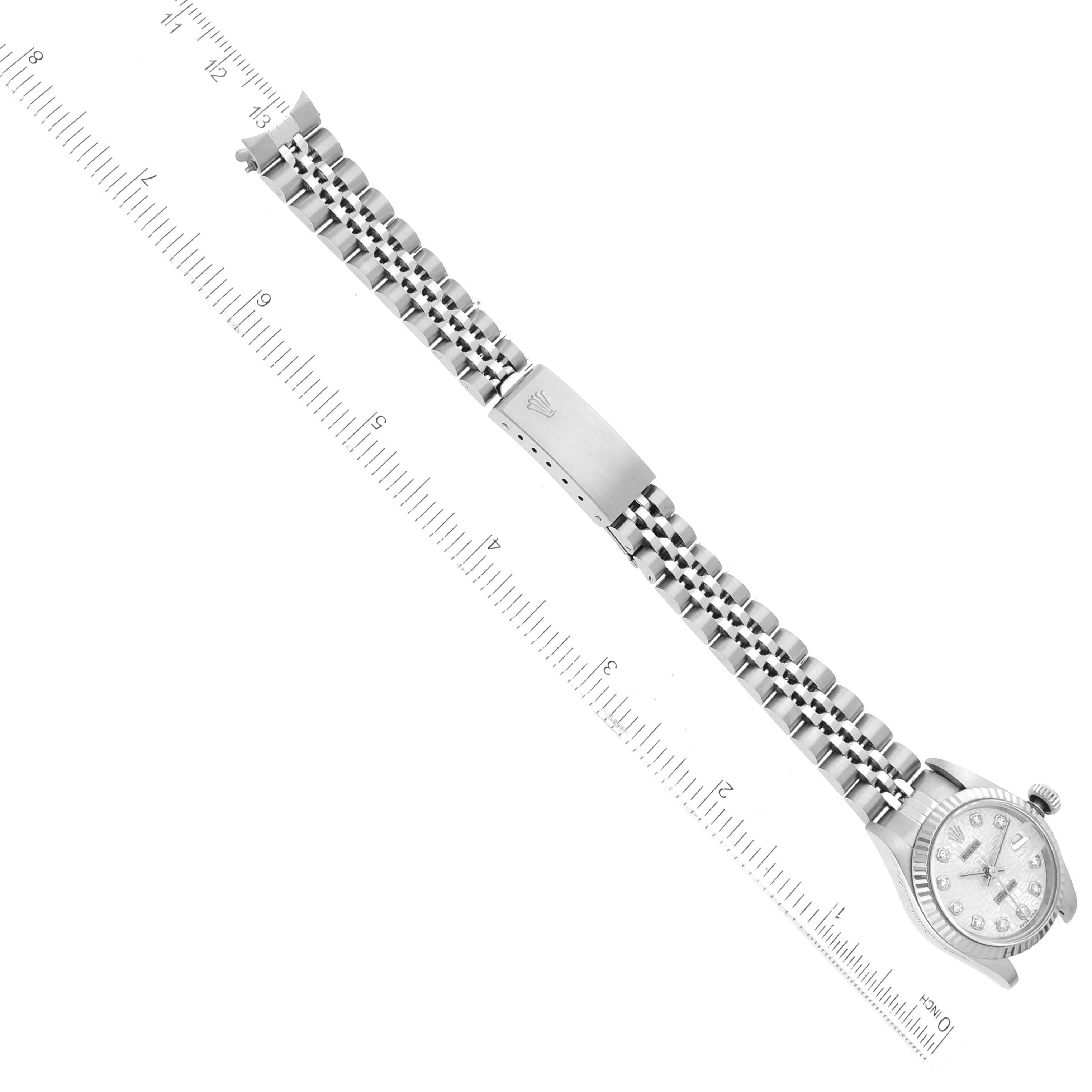 The image shows the Rolex Datejust 69174 Women's Stainless Steel White Dial 69174 Women's Stainless Steel White Dial watch laid flat, displaying the bracelet, clasp, and watch face from an aerial angle.