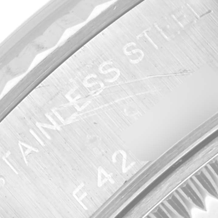 This close-up image shows the stainless steel case back of a Rolex Datejust 79174 Women's Stainless Steel Mother of Pearl Dial 79174 Women's Stainless Steel Mother of Pearl Dial watch.