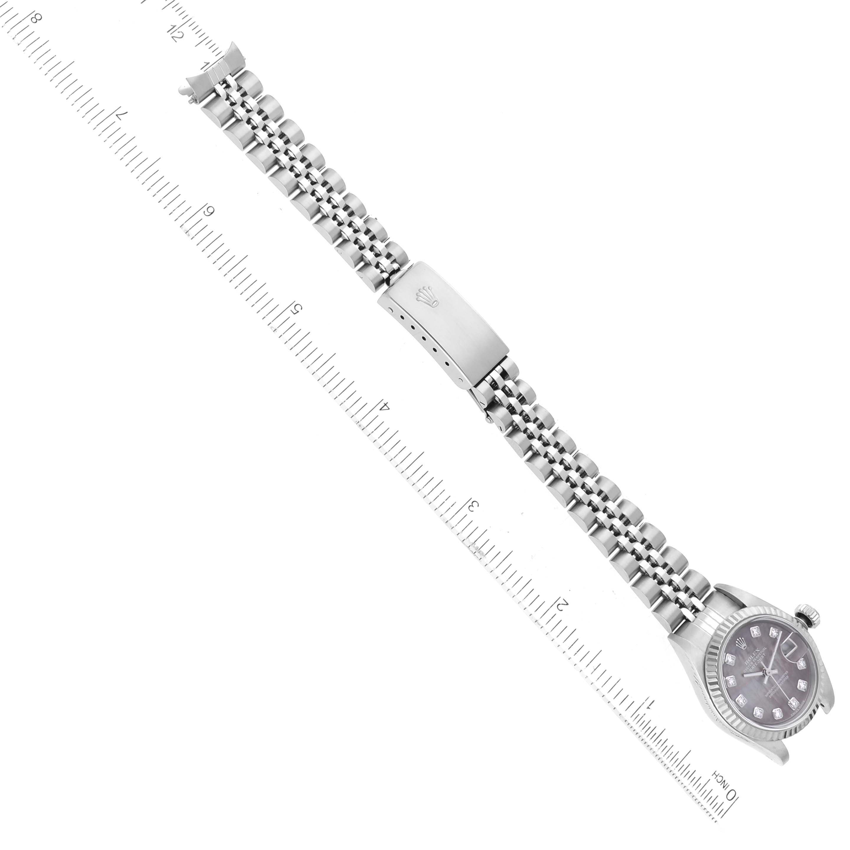The image shows a Rolex Datejust 79174 Women's Stainless Steel Mother of Pearl Dial 79174 Women's Stainless Steel Mother of Pearl Dial watch at an overhead angle, displaying the face, bracelet, and clasp.