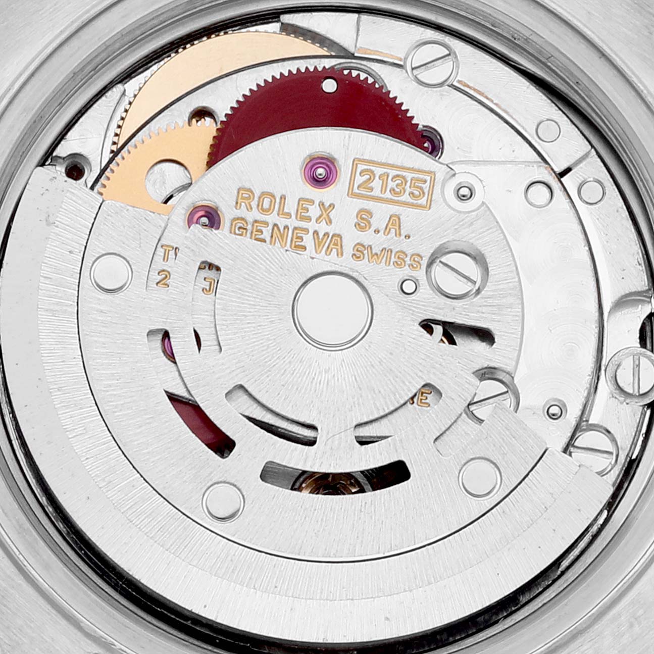 This image shows the internal mechanical movement of a Rolex Datejust 69174 Women's Stainless Steel Silver Dial 69174 Women's Stainless Steel Silver Dial watch, featuring gears and the engraved model details.