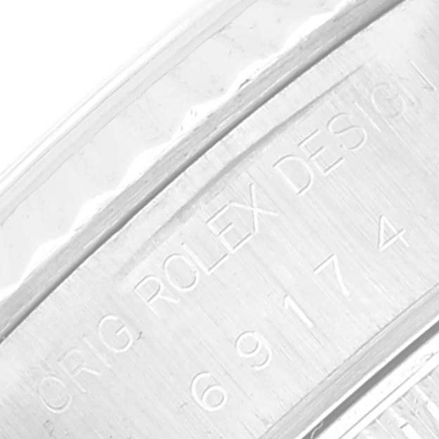 This image shows a close-up of the case side engraving on a Rolex Datejust 69174 Women's Stainless Steel Silver Dial 69174 Women's Stainless Steel Silver Dial watch.