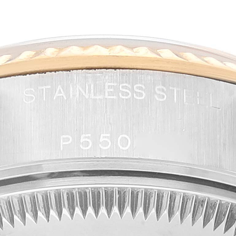 This close-up shows the side engraving of a Rolex Datejust 79173 Women's Steel and Gold (two tone) Black Dial 79173 Women's Steel and Gold (two tone) Black Dial model watch indicating "STAINLESS STEEL" and "P550".