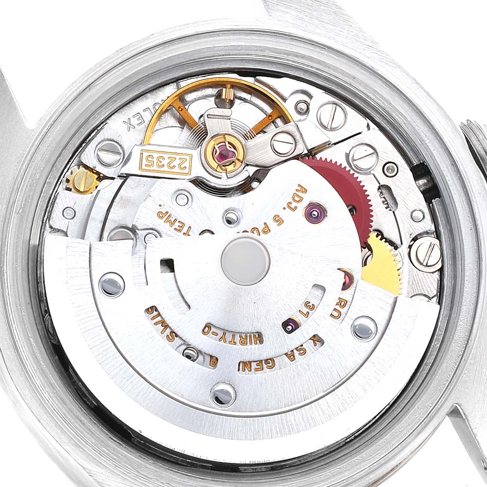 The image shows a close-up view of the movement mechanism inside a Rolex Datejust 79173 Women's Steel and Gold (two tone) Black Dial 79173 Women's Steel and Gold (two tone) Black Dial watch, revealing intricate gears and components.